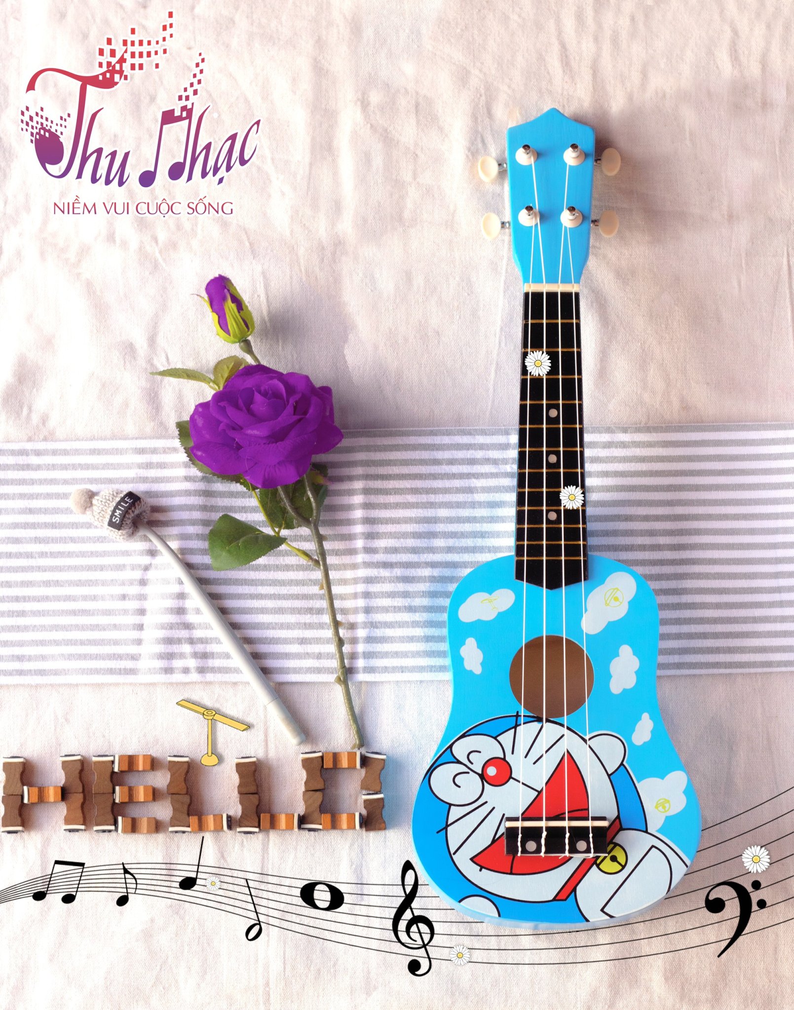 Đàn ukulele màu xanh hình doremon