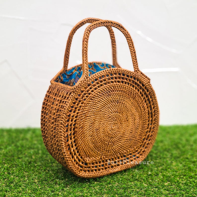 Vintage handmade light brown woven natural straw bohemian satchel bag with dark blue flowers, natural common water hyacinth satchel bag