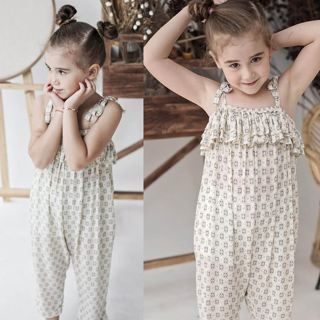 JUMPSUIT DÀI ĐEN CỔ LẬT TRỄ VAI