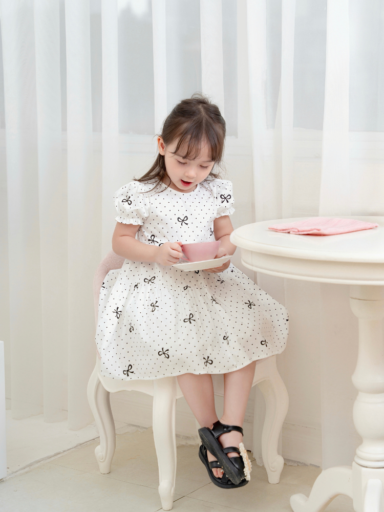 Váy 3T nơ chấm bi đen xinh xắn