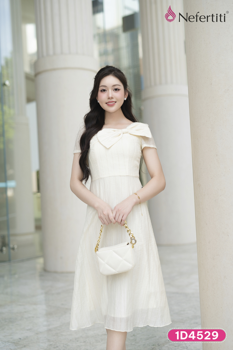 1D4529 - Đầm kem phối nơ cổ