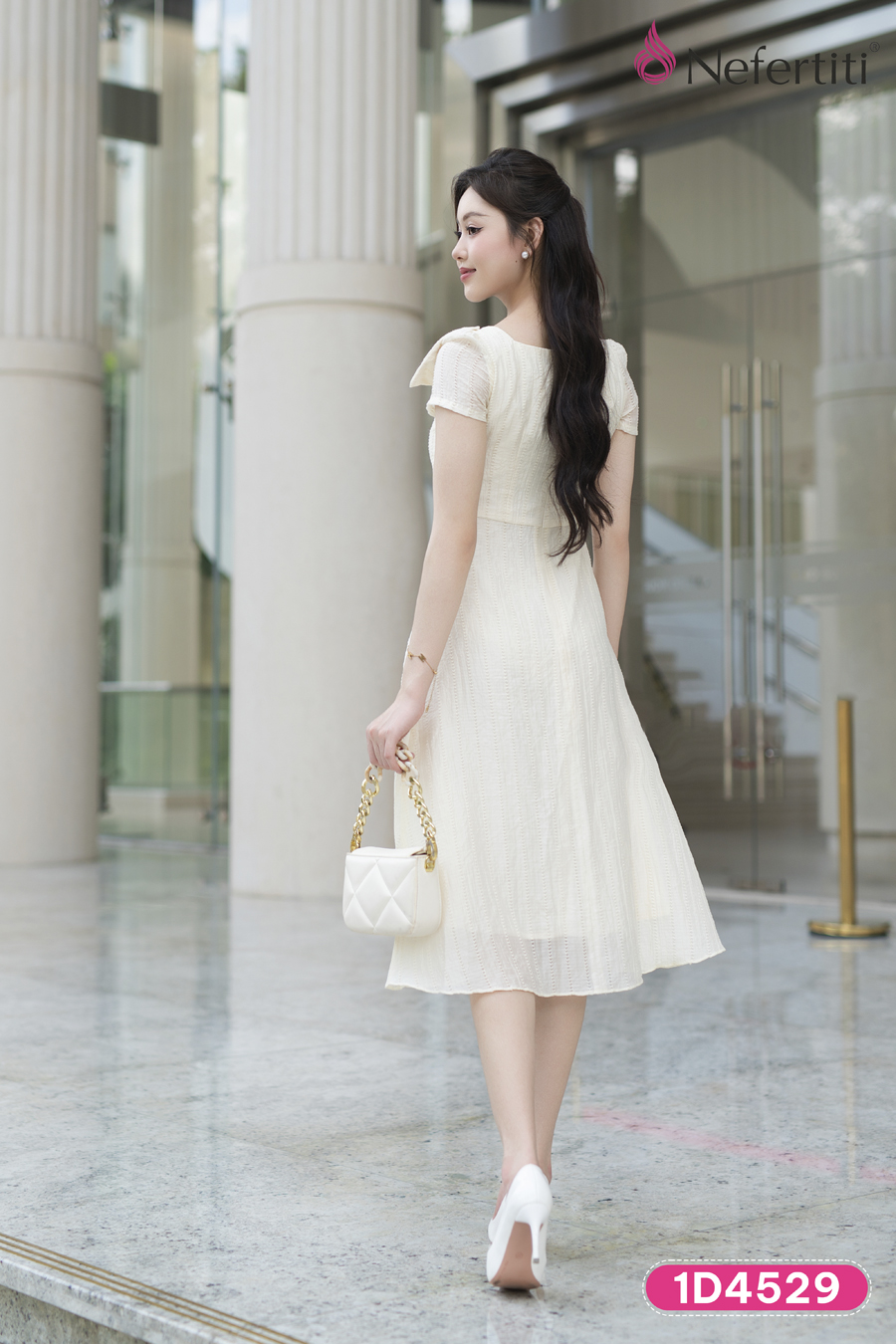 1D4529 - Đầm kem phối nơ cổ