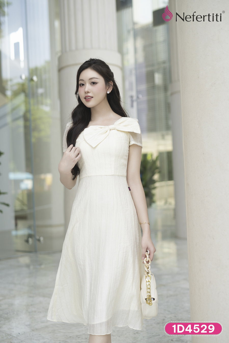 1D4529 - Đầm kem phối nơ cổ