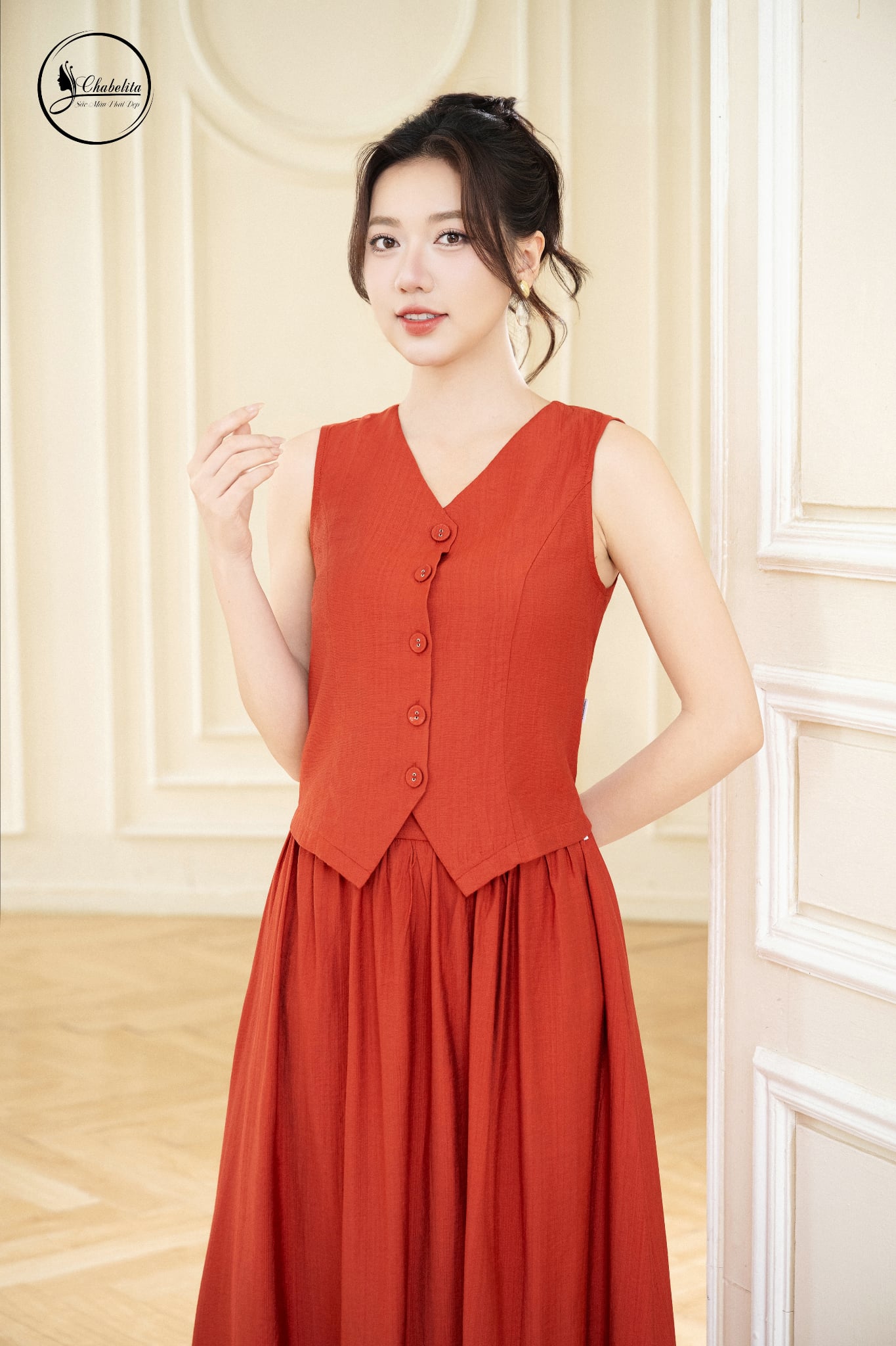 Sét bộ áo sát nách cổ tim phối chân váy màu cam