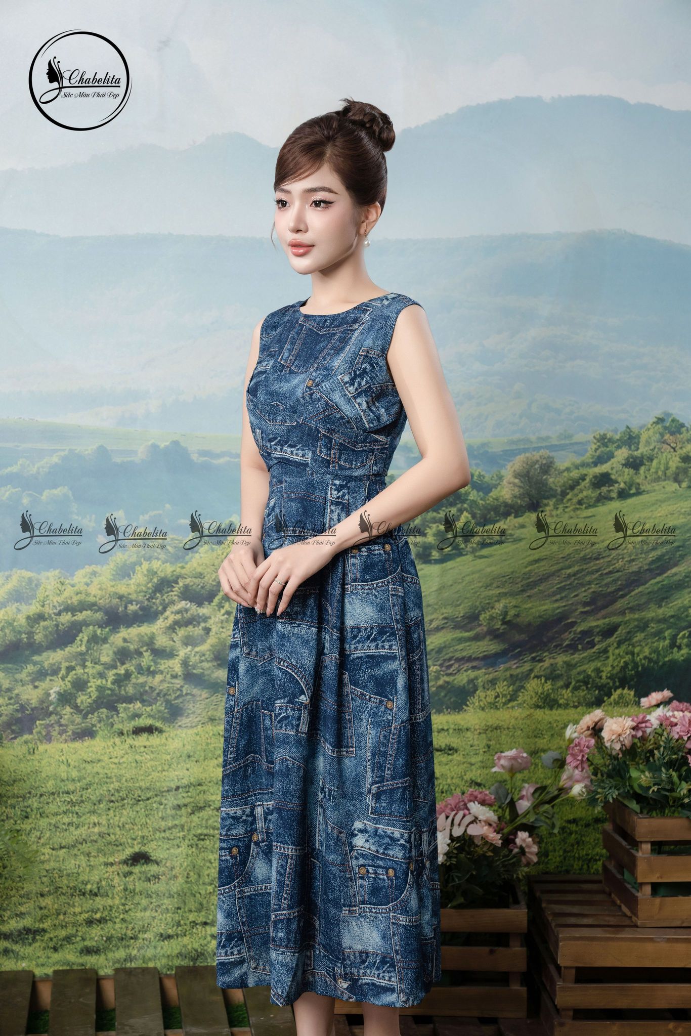 Đầm sát nách họa tiết phối dây chéo eo màu xanh