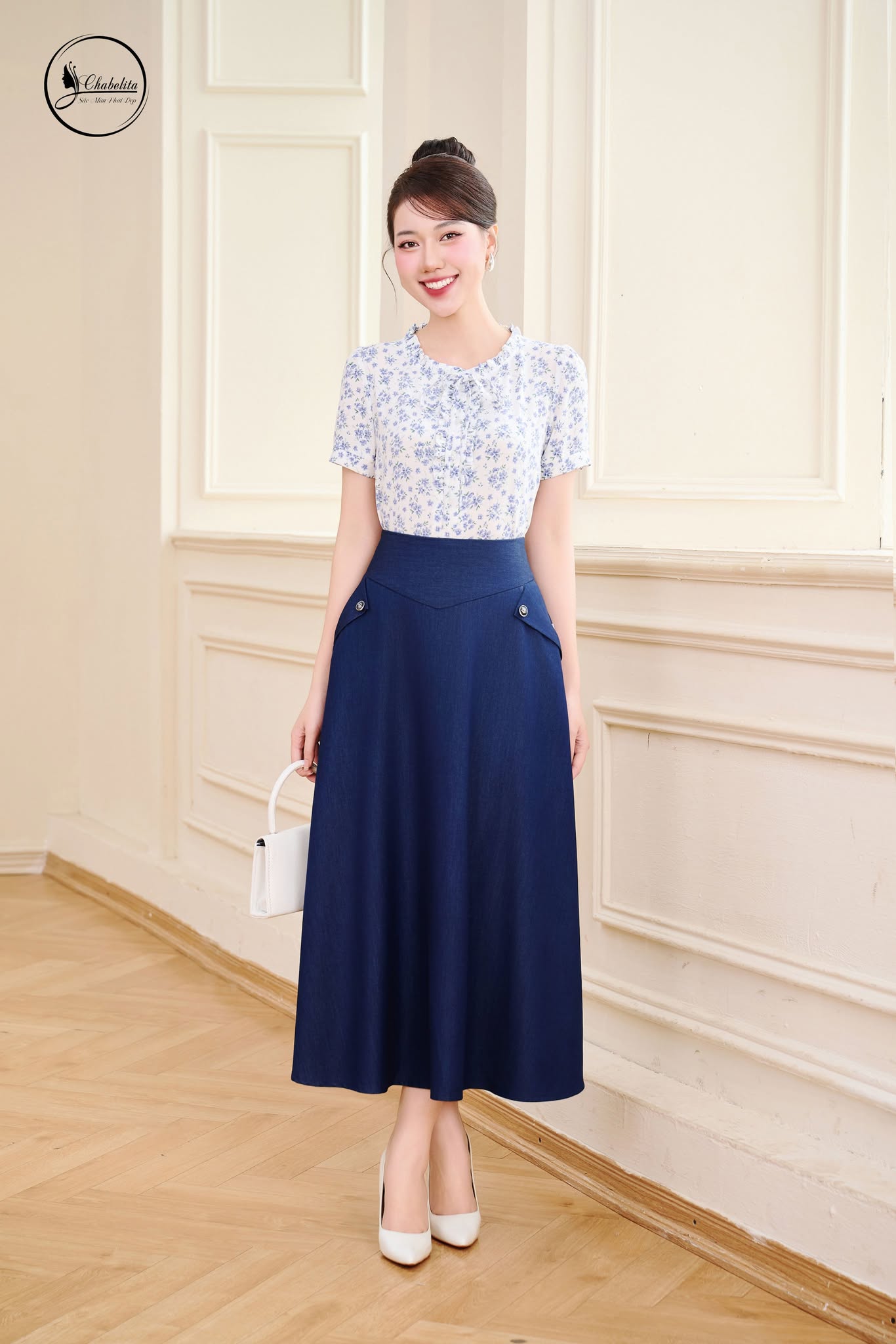 Chân váy xòe túi chéo màu xanh đậm