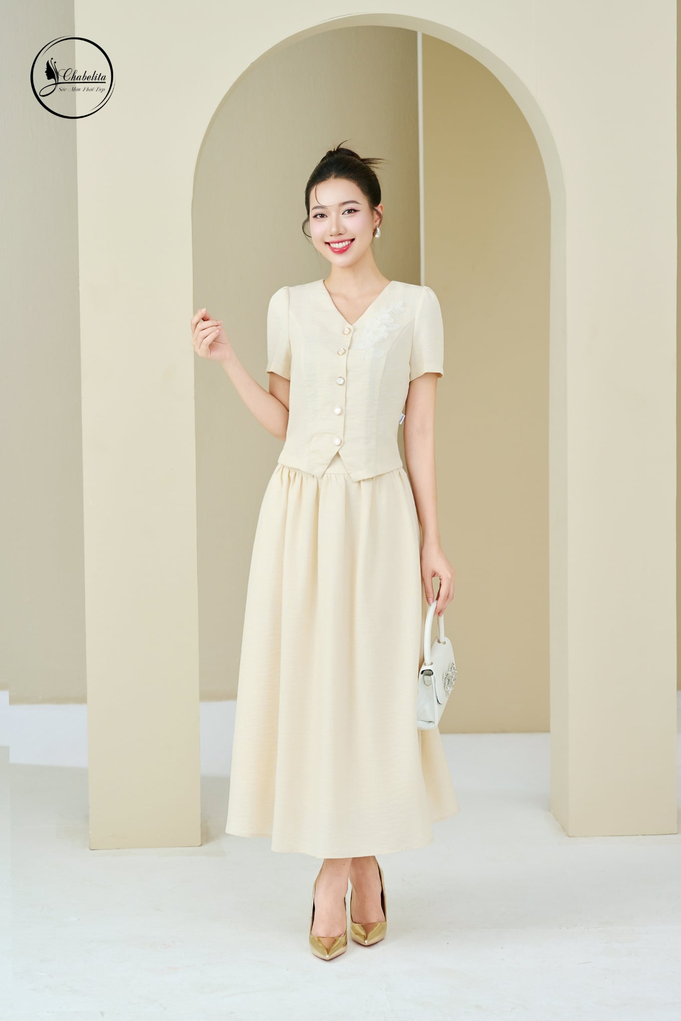 Sét bộ áo tay cộc cổ tim phối chân váy màu be