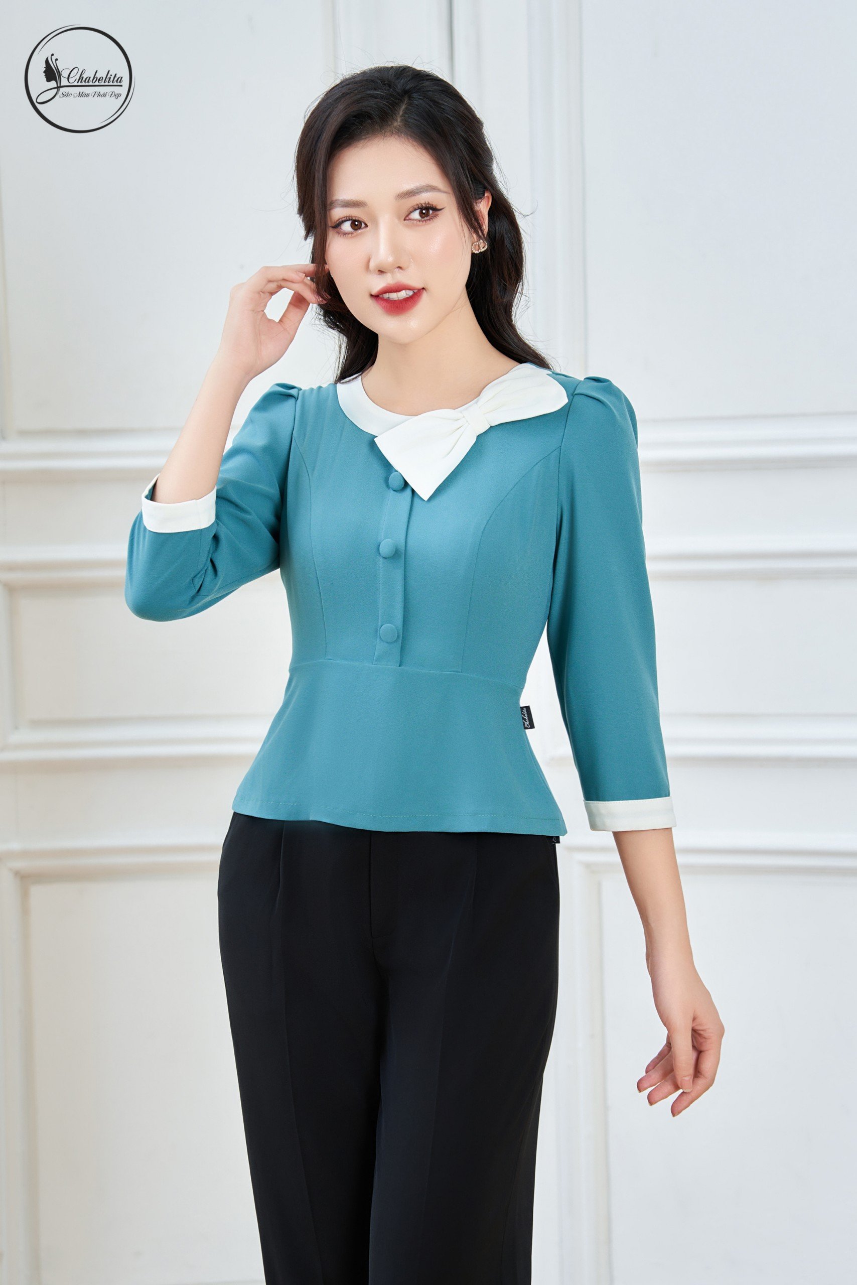 Sơ mi cổ tròn phối nơ màu xanh