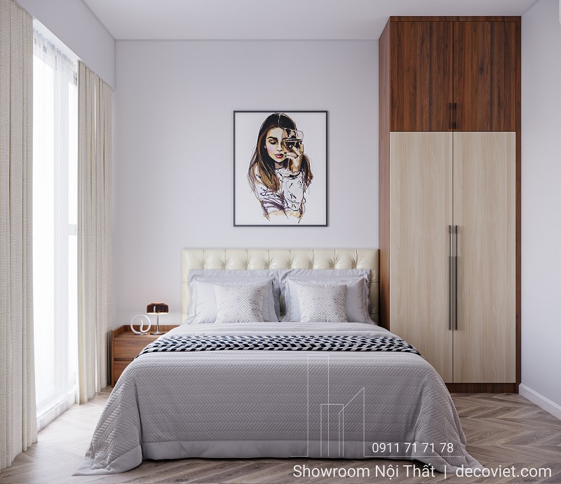 Phòng ngủ phụ với giường bọc nệm và tủ áo gỗ hiện đại.