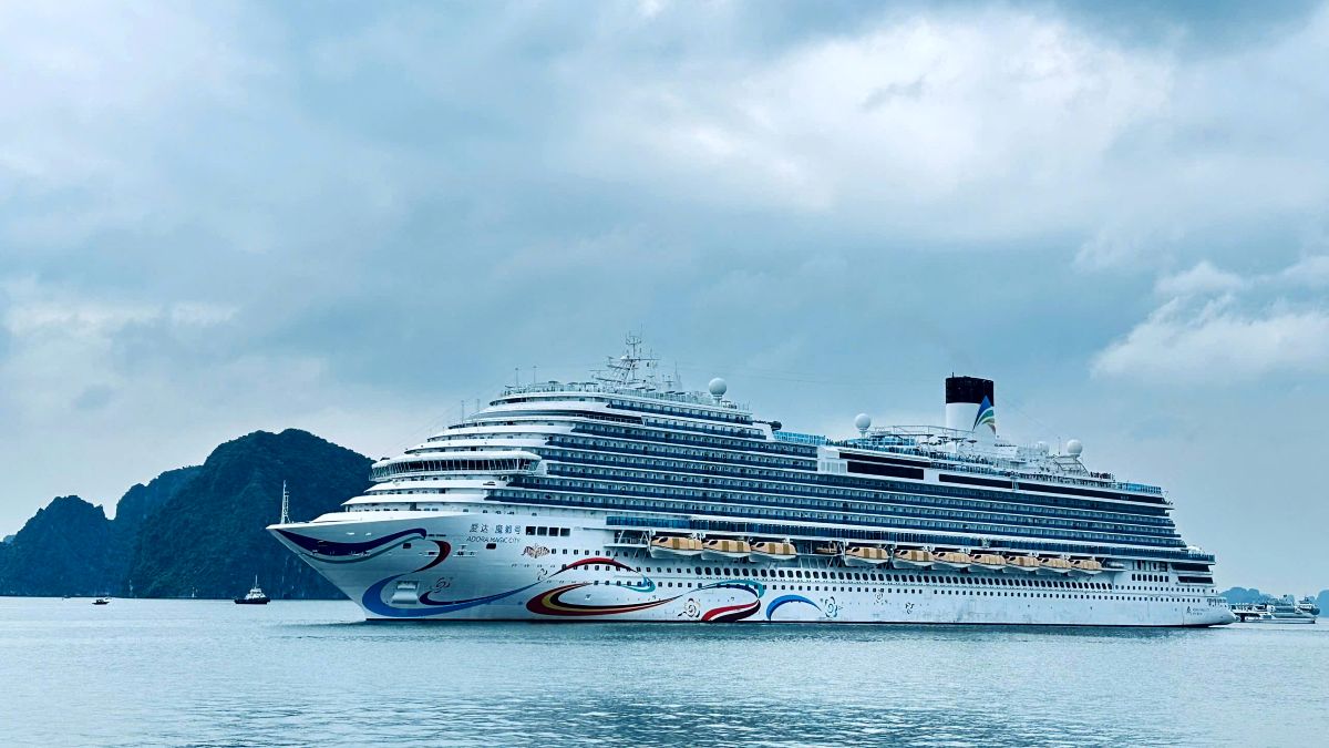 Cruise ship anchored in Ha Long Bay among limestone islands