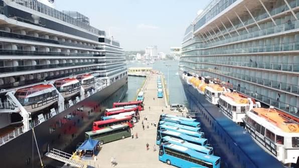 Two cruise ships and lines of coaches at Ha Long International Cruise Port