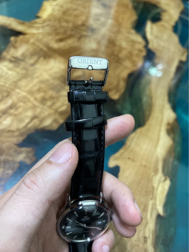 Orient Bambino Gen mặt màu đen vỏ thép bạc dây da Made in