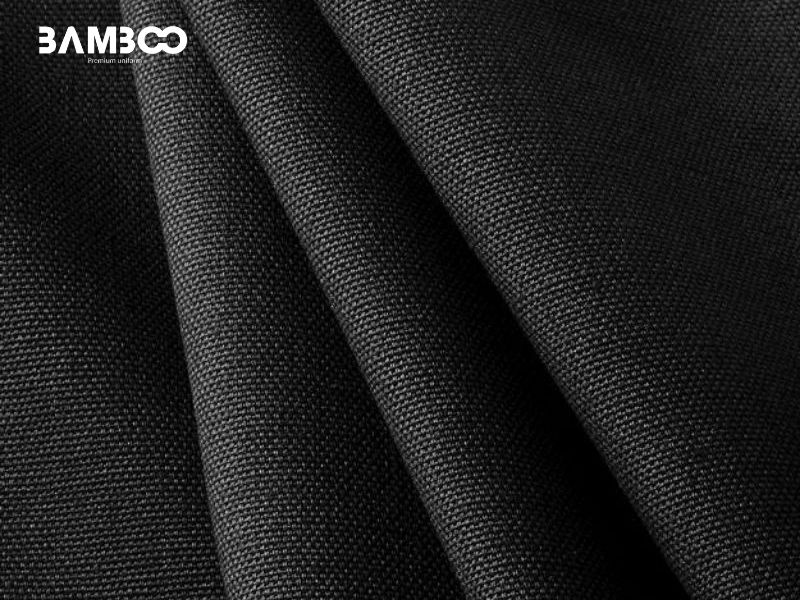 Chất vải may chân váy đồng phục đen cần co giãn, ít nhăn, bền màu