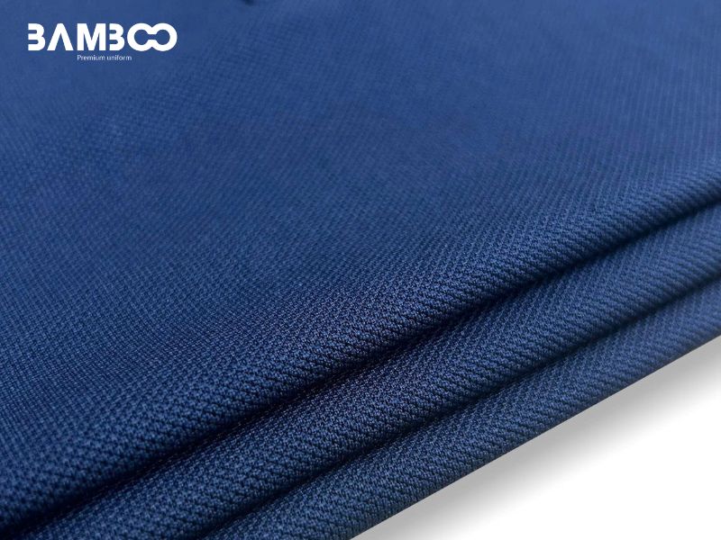 Vải may đồng phục xanh navy bền màu, giữ form tốt và phù hợp từng loại trang phục