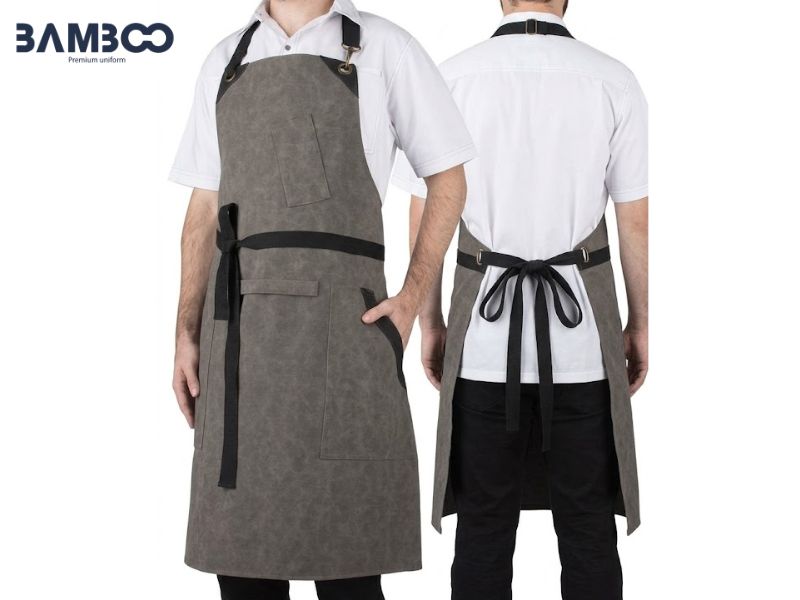 May tạp dề đồng phục màu xám ưu tiên vải bền, đường may chắc, logo sắc nét, kích thước linh hoạt