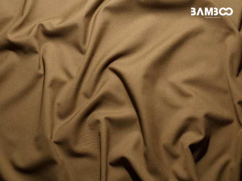 Vải kaki 65/35 bền đẹp, giữ form, thấm hút tốt, giá hợp lý nhưng hơi cứng