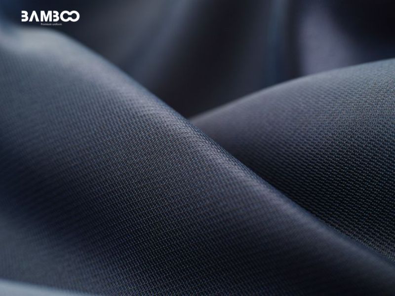 Chất liệu vải may đồng phục đen bền bỉ