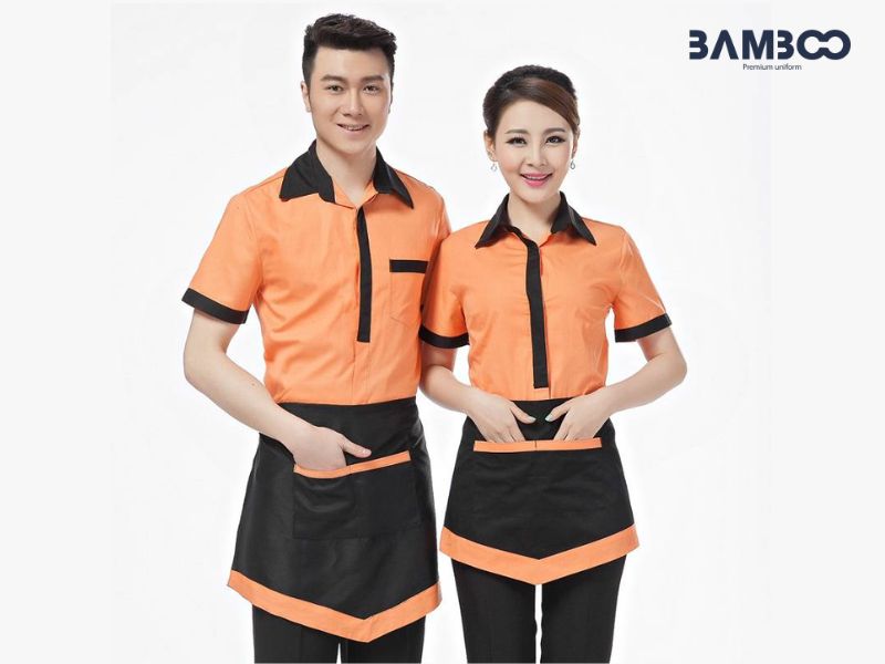 Tạp dề nửa thân đen viền cam năng động, bền đẹp, tiện dụng, nổi bật và chuyên nghiệp