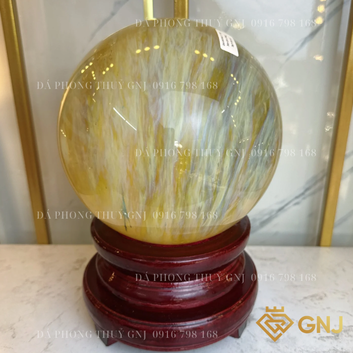 Quả bi cầu núi lửa, quả bi cầu thủy tinh vàng