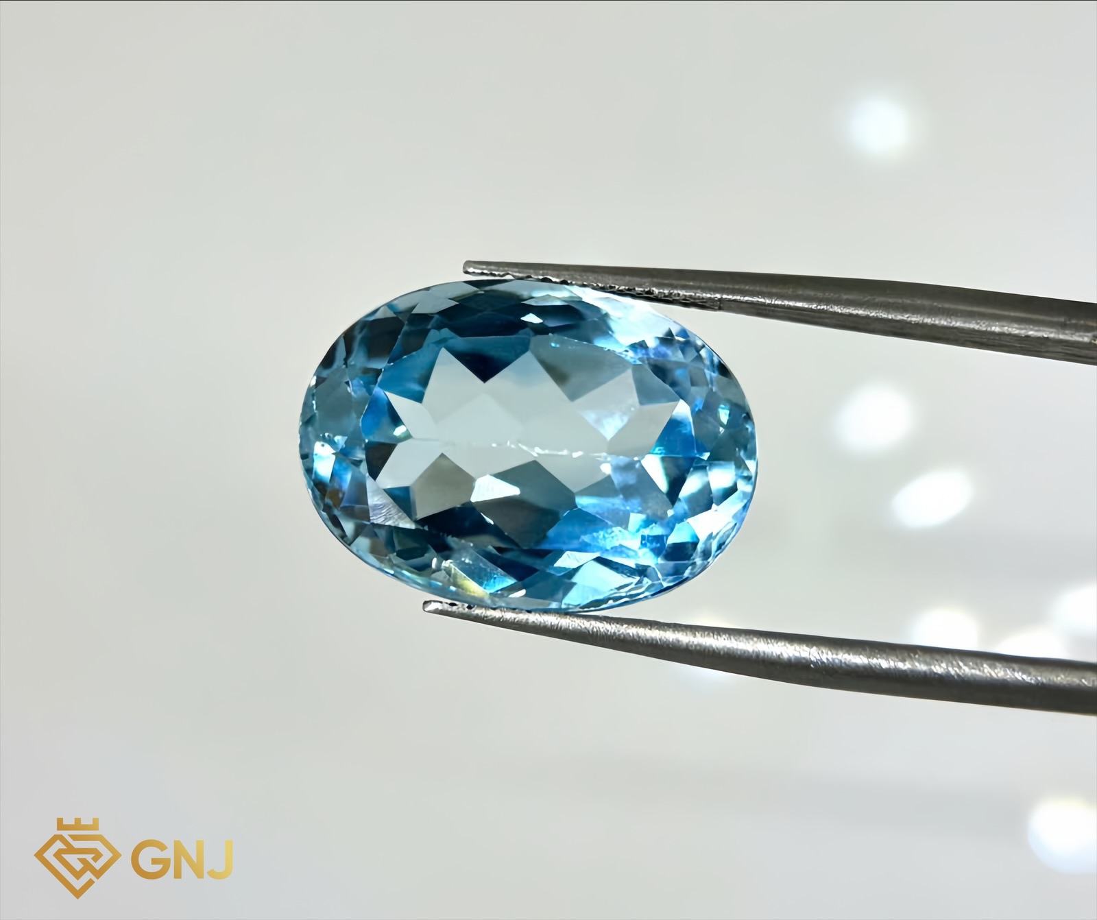 Đá Topaz Xanh Tự Nhiên 16.2ct — mặt trước, đá quý tự nhiên có kiểm định GNJ