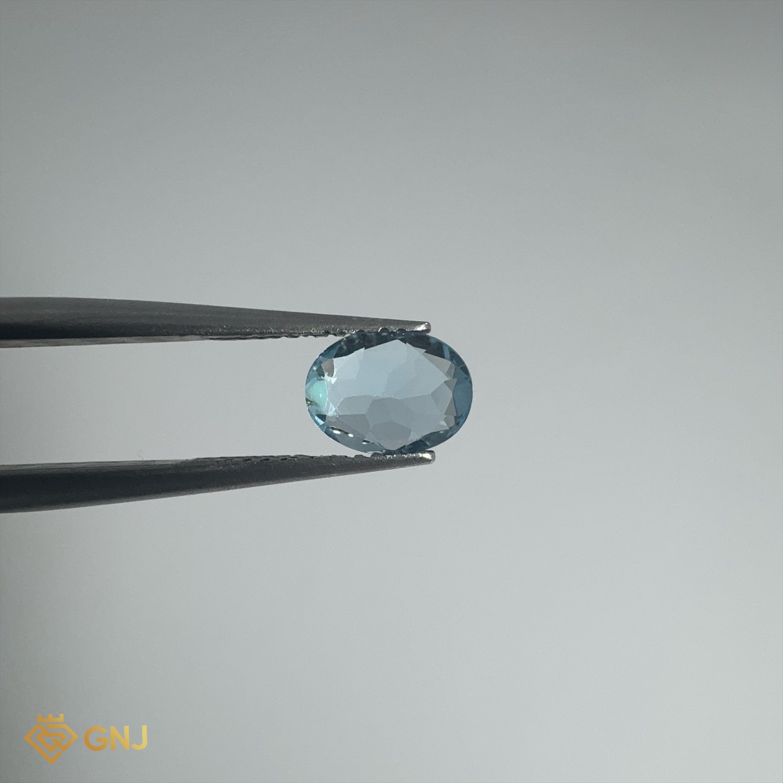 Đá Topaz Xanh Tự Nhiên 0.9ct — 6.7x5.1mm — mặt bên