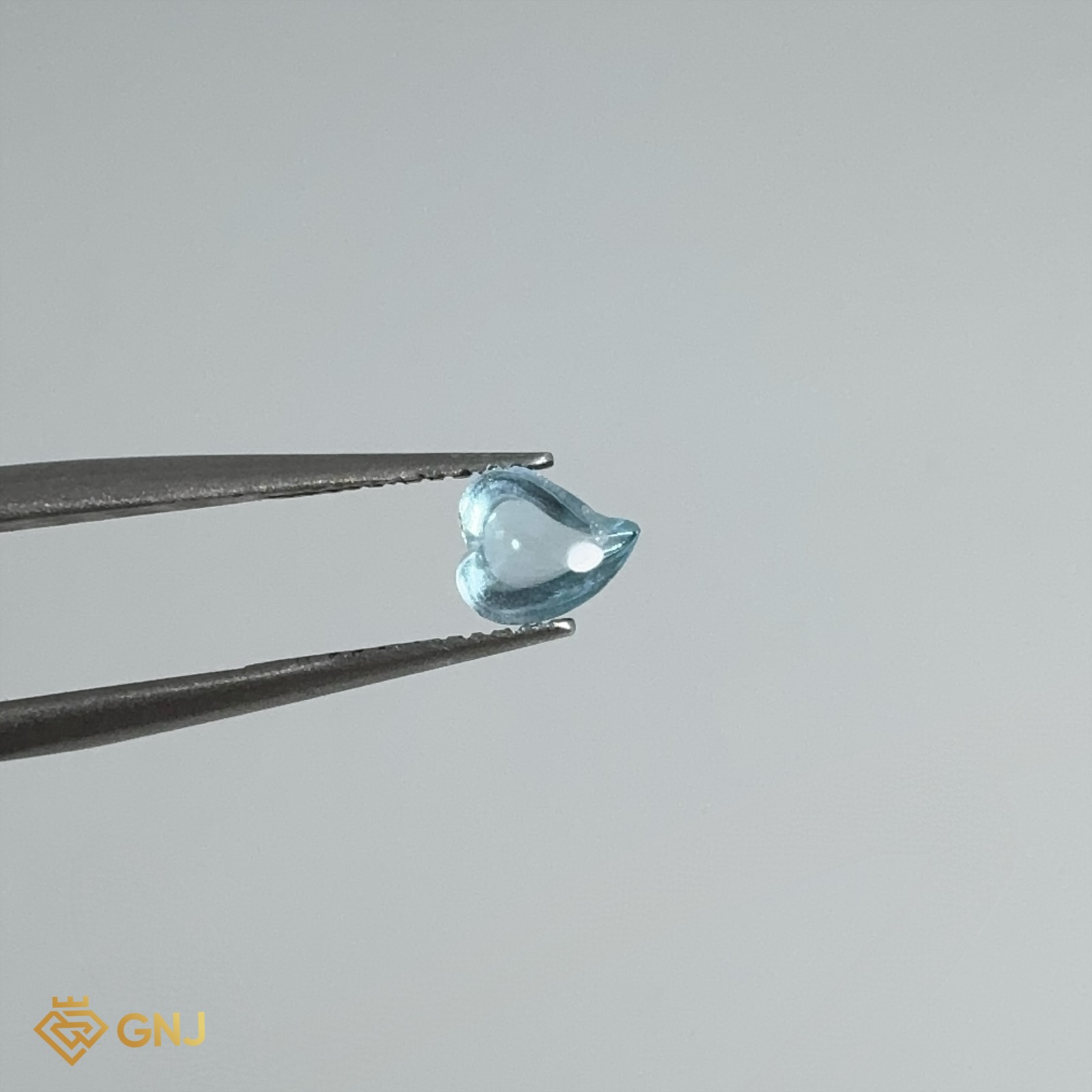 Đá Topaz Xanh Tự Nhiên 0.6ct — 5.7x5.0mm — mặt trước, đá quý tự nhiên có kiểm định GNJ