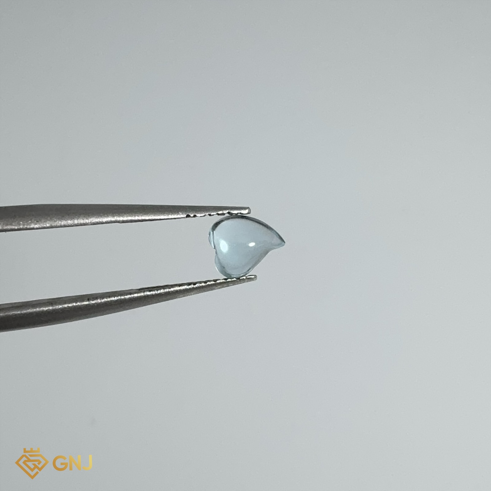 Đá Topaz Xanh Tự Nhiên 0.6ct — 5.7x5.0mm — mặt bên