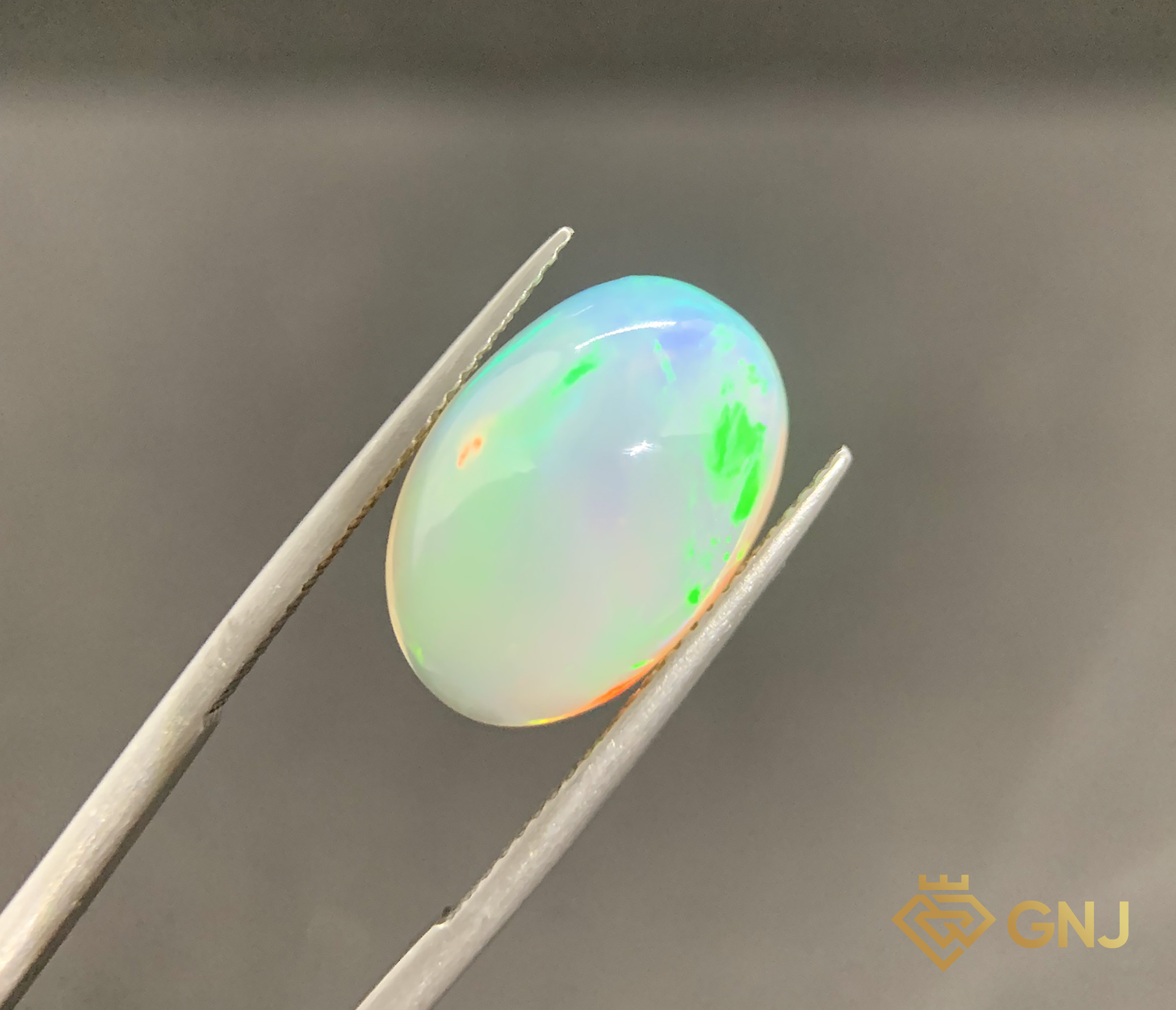 Viên Đá Opal Tự Nhiên 7.1ct — Cabochon — mặt trước, đá quý tự nhiên có kiểm định GNJ