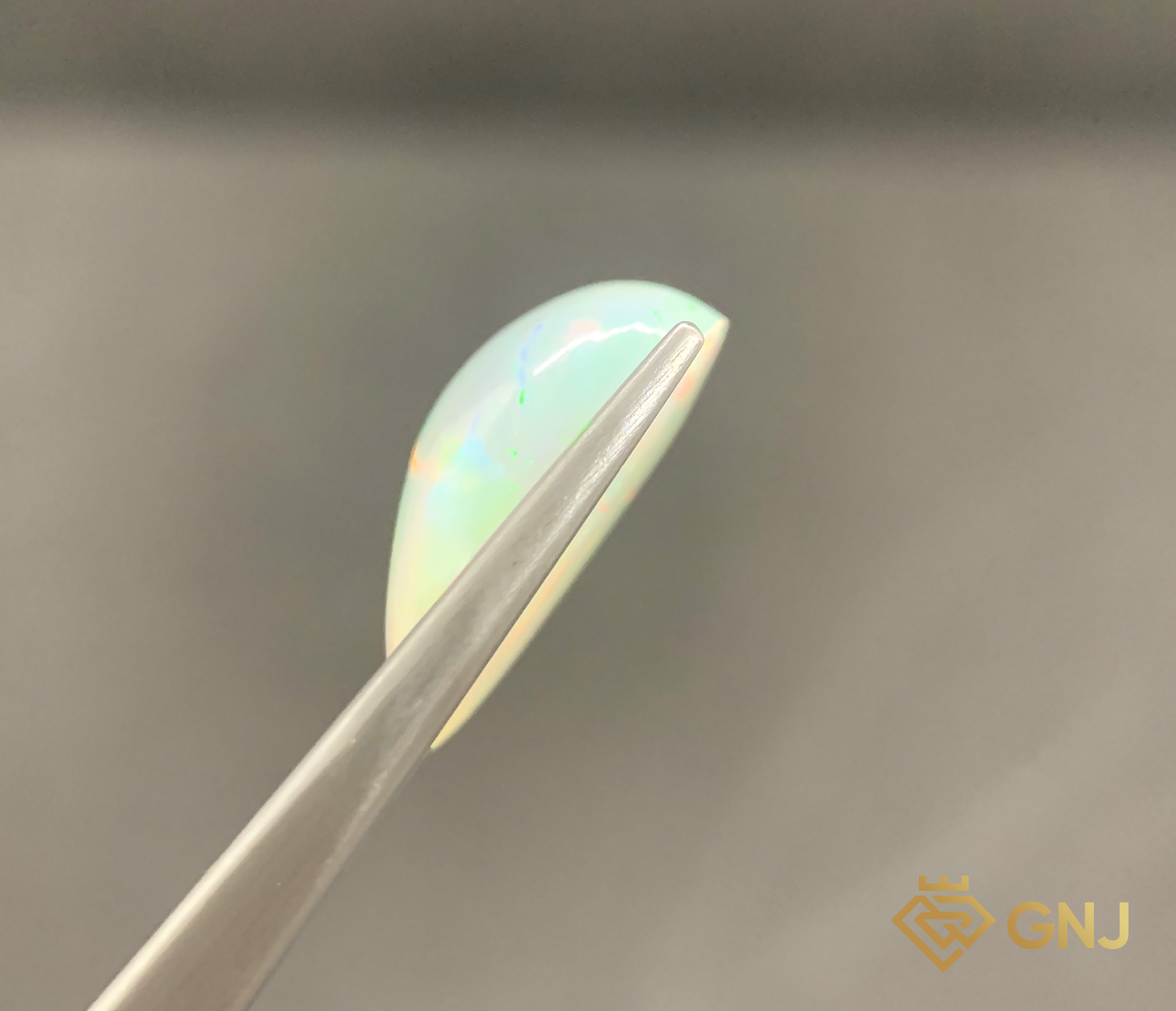 Viên Đá Opal Tự Nhiên 7.1ct — Cabochon — mặt bên