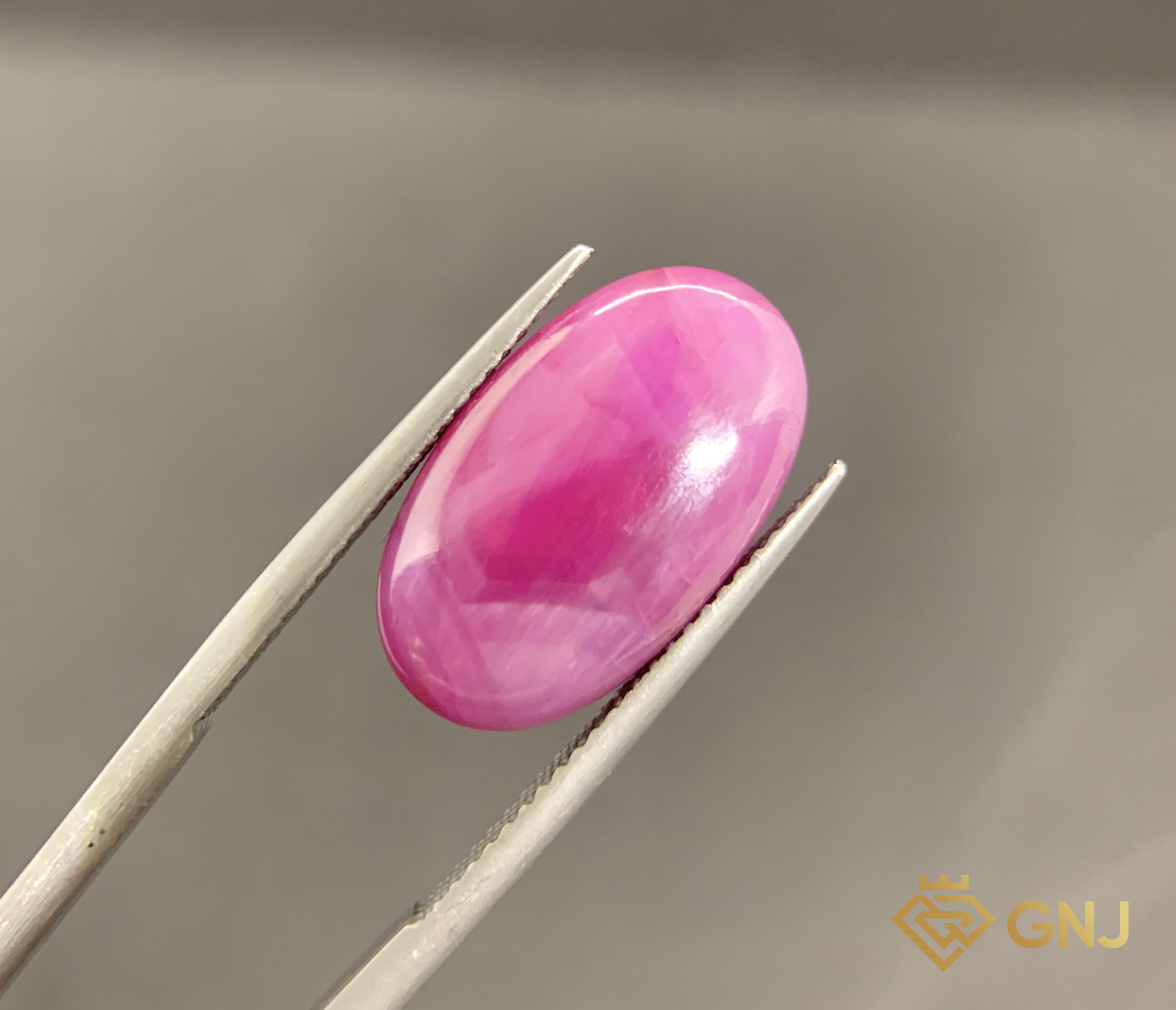 Viên Đá Sapphire Hoa Văn Lục Yên 12.1ct — Cabochon — mặt trước, đá quý tự nhiên có kiểm định GNJ
