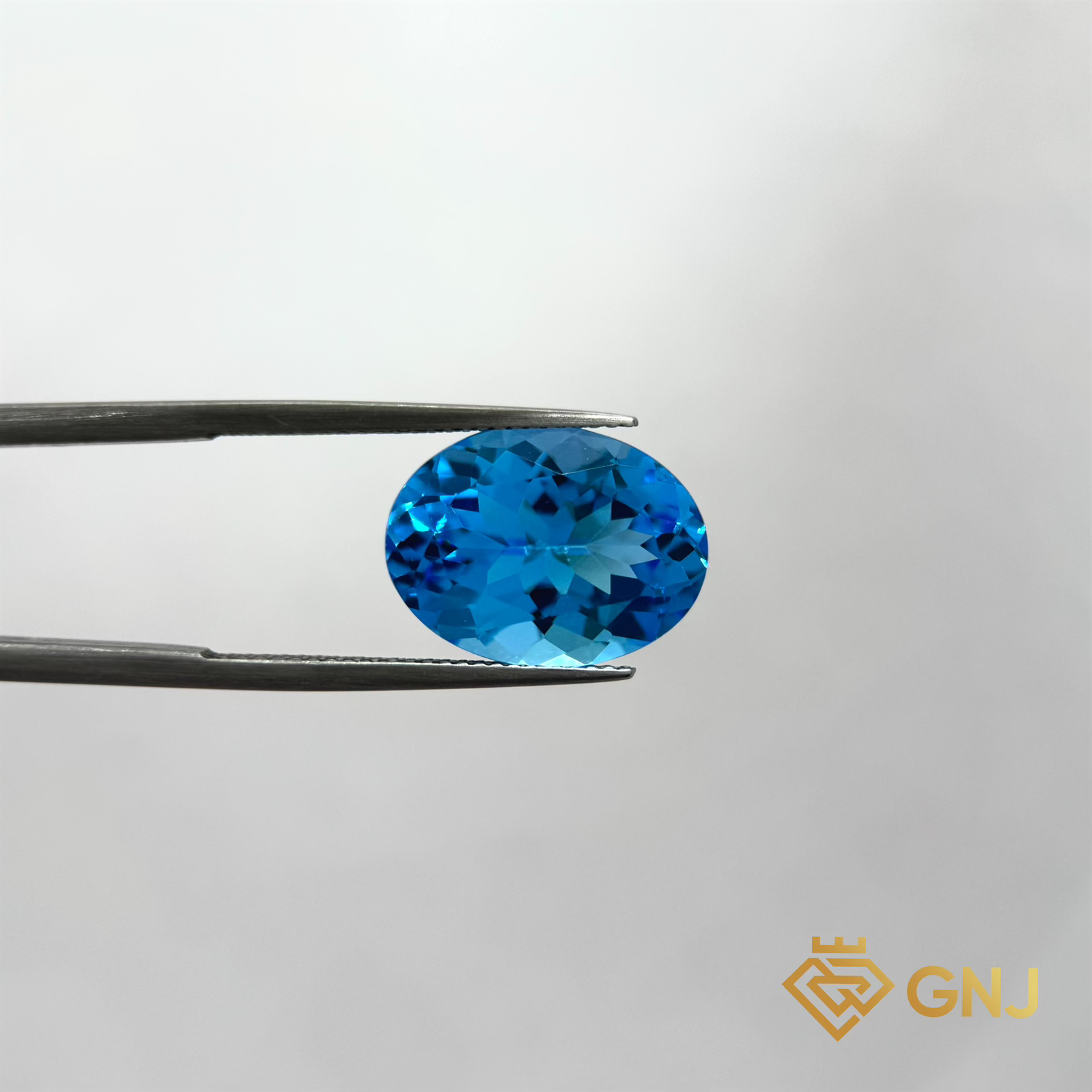 Đá Topaz Xanh Tự Nhiên Xanh Dương 11.05ct — mặt trước, đá quý tự nhiên có kiểm định GNJ
