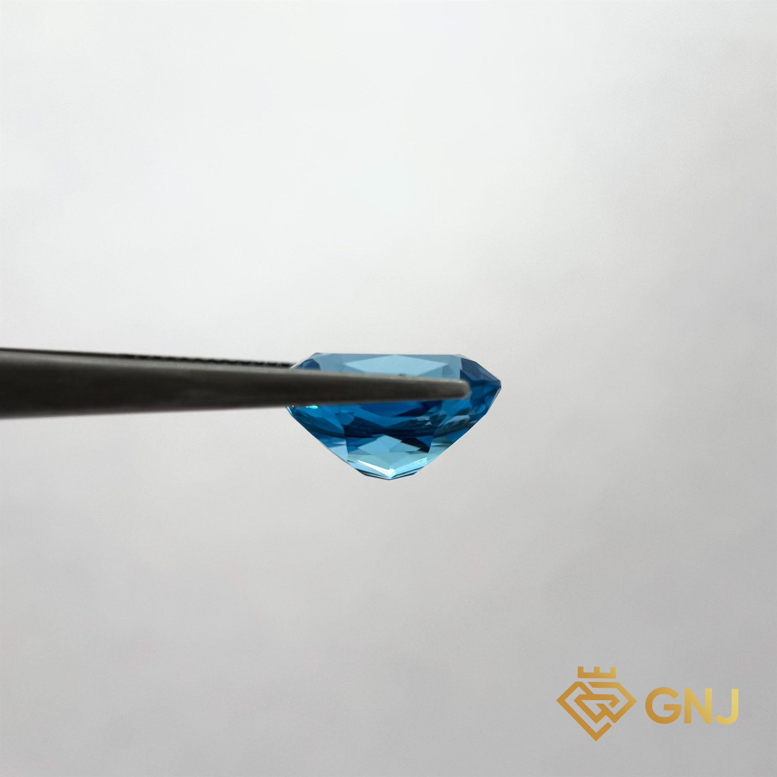 Đá Topaz Xanh Tự Nhiên Xanh Dương 9.6ct — mặt bên