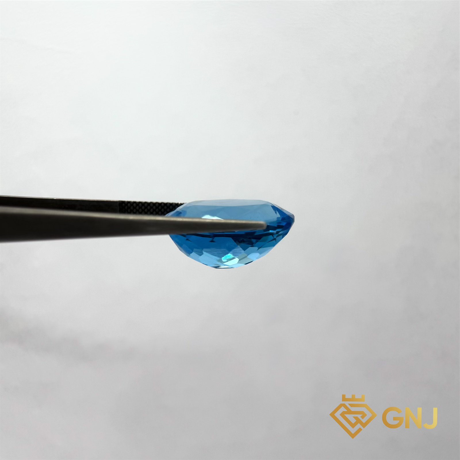 Đá Topaz Xanh Tự Nhiên 22.65ct — mặt bên