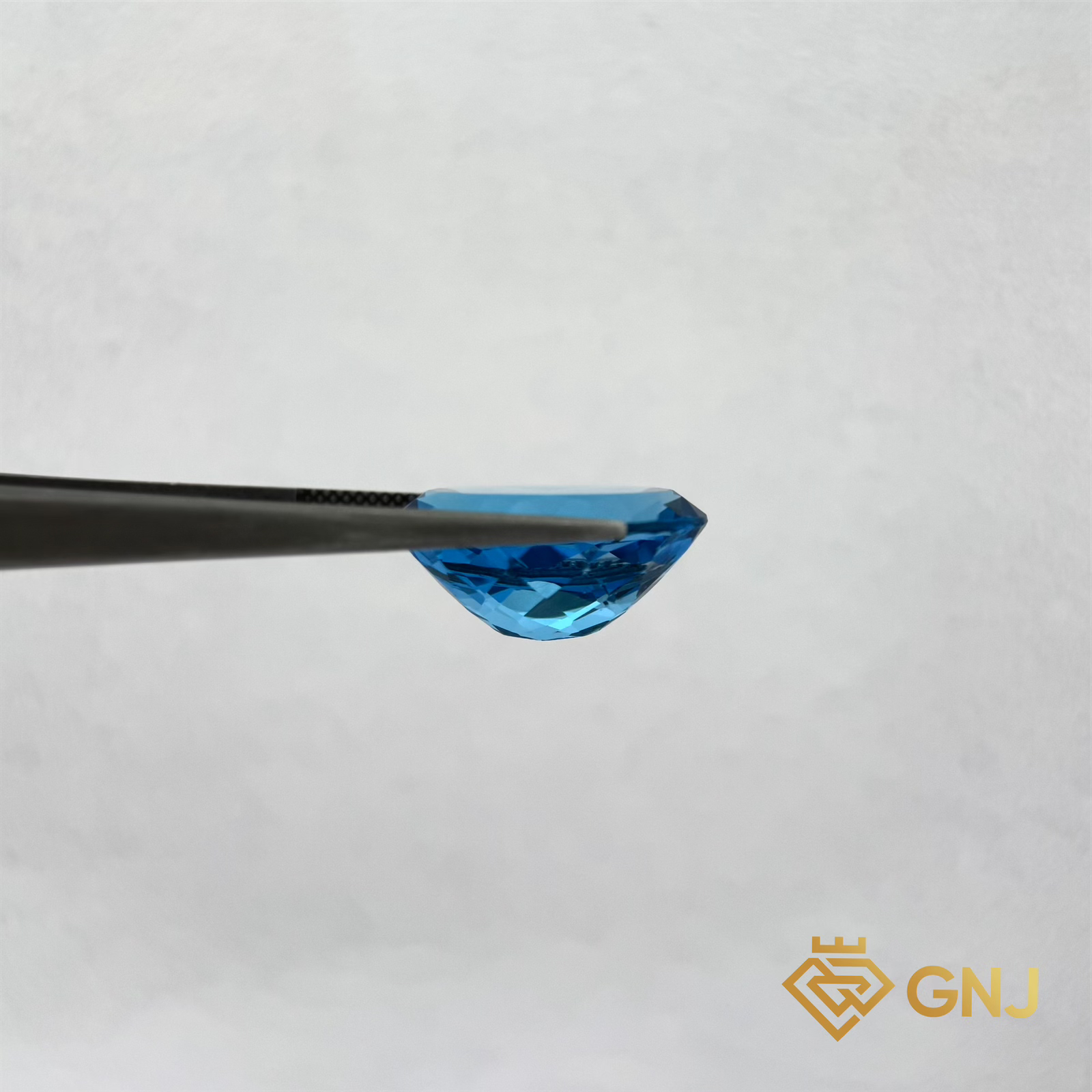Đá Topaz Xanh Tự Nhiên 21.3ct — mặt bên