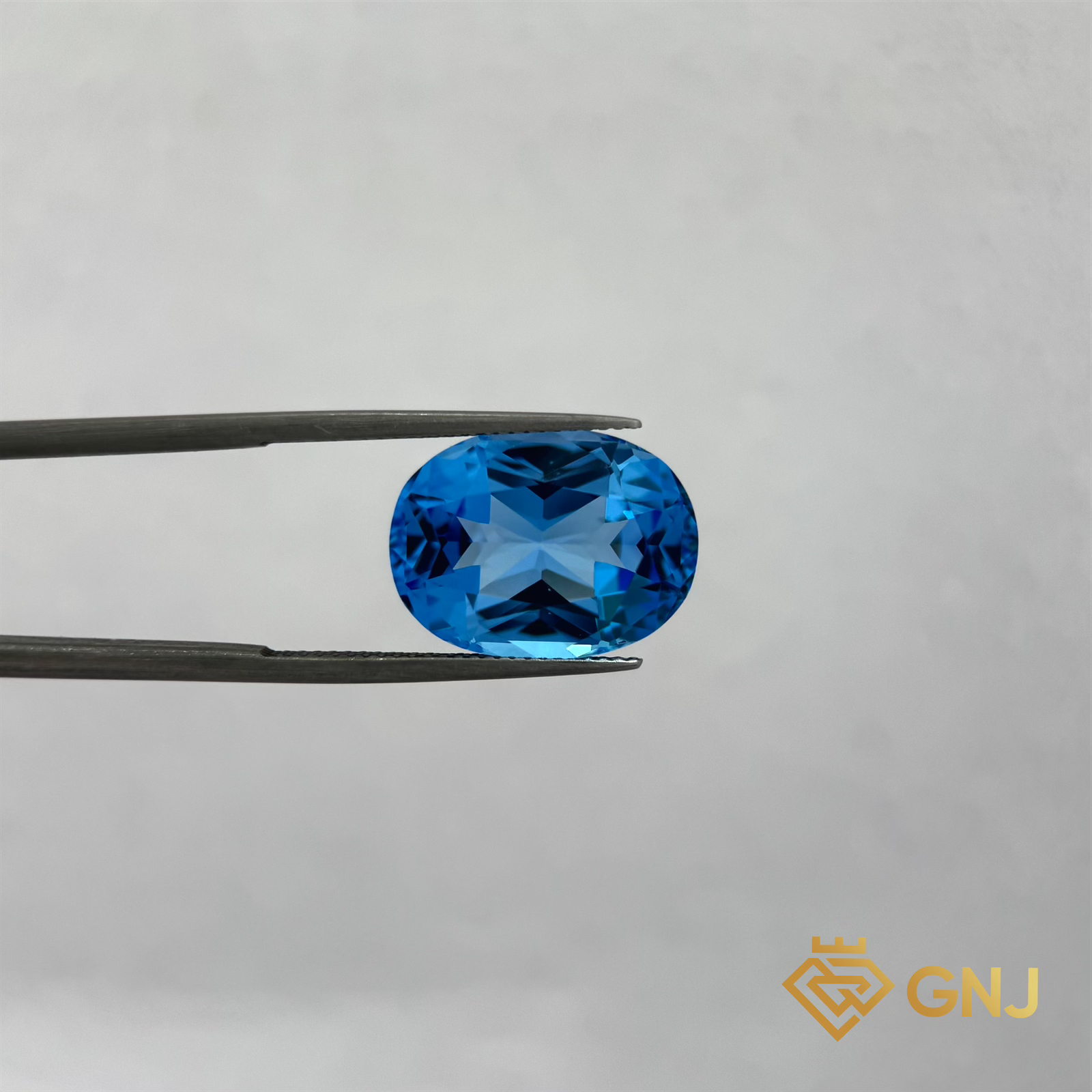 Đá Topaz Xanh Tự Nhiên Xanh Dương 15ct — mặt trước, đá quý tự nhiên có kiểm định GNJ