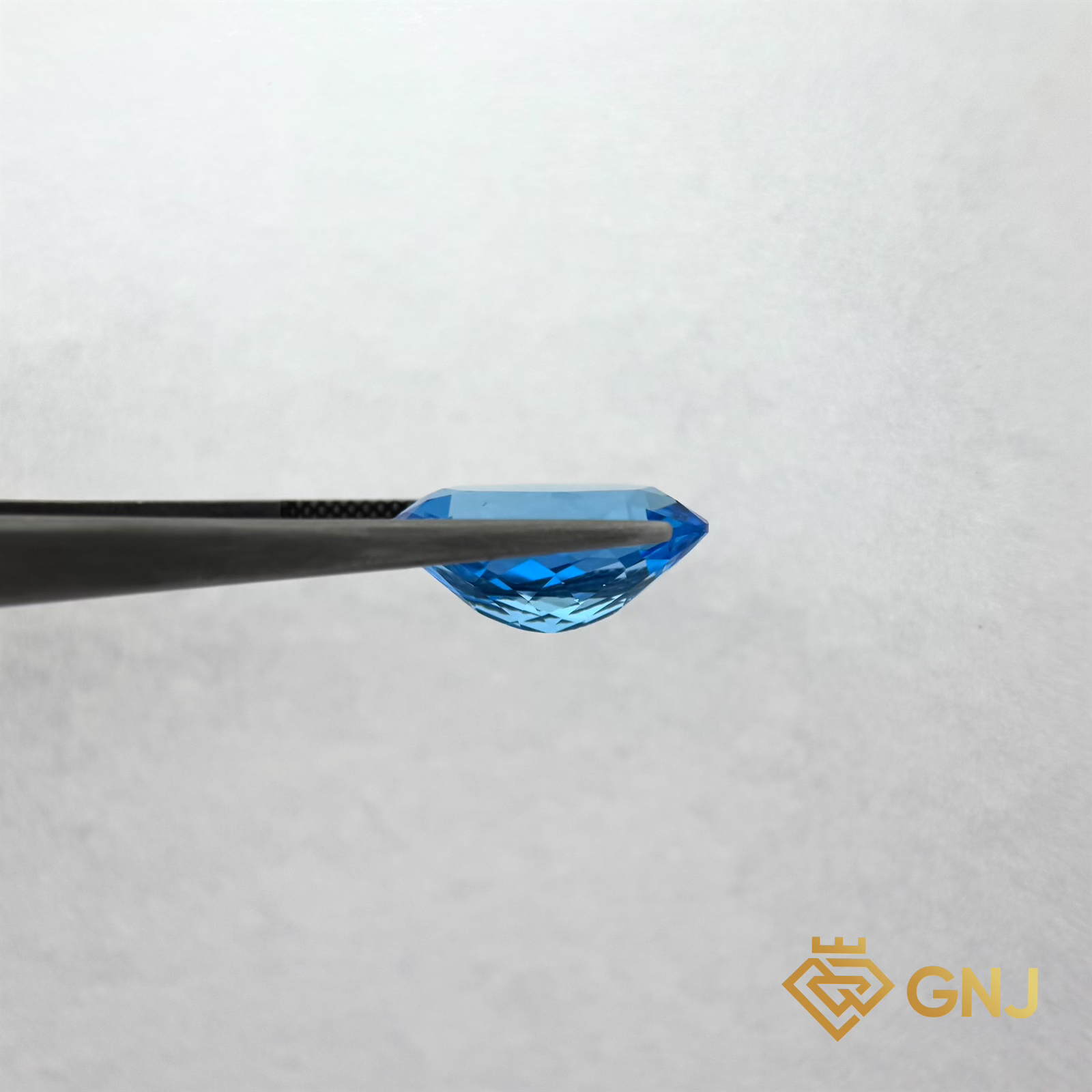 Đá Topaz Xanh Tự Nhiên 14.3ct — mặt bên