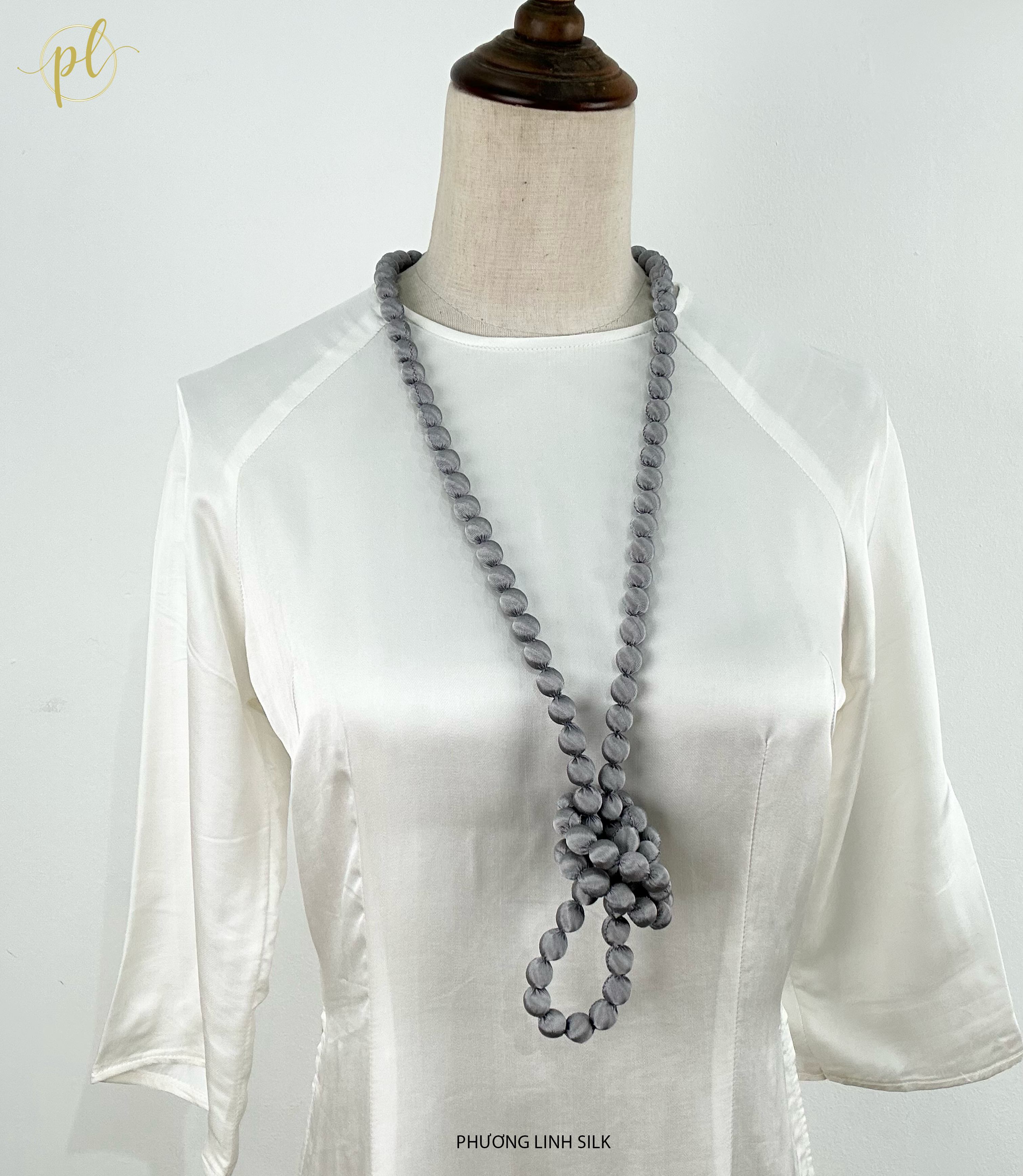 VÒNG HẠT GỖ BỌC LỤA