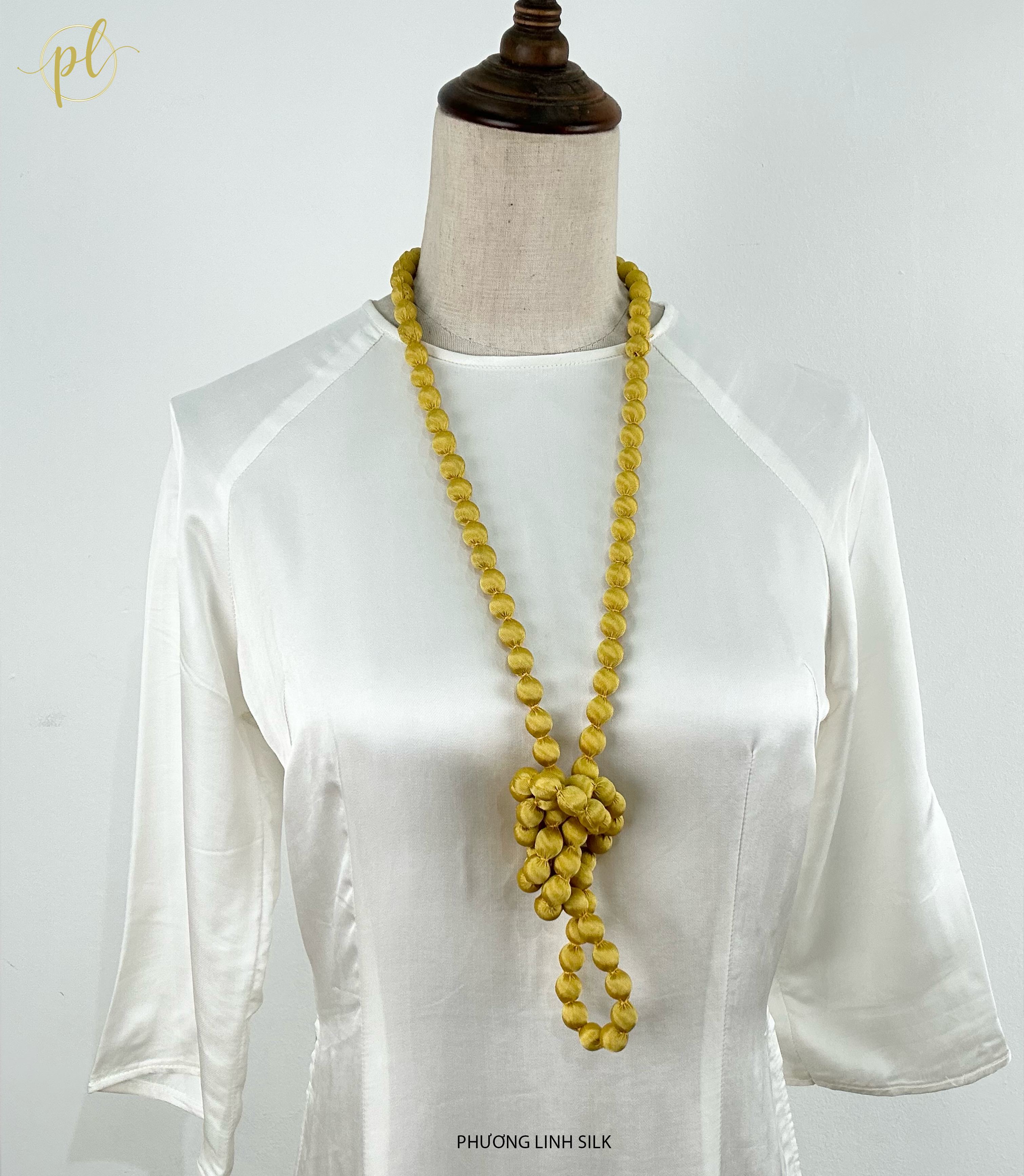 VÒNG HẠT GỖ BỌC LỤA