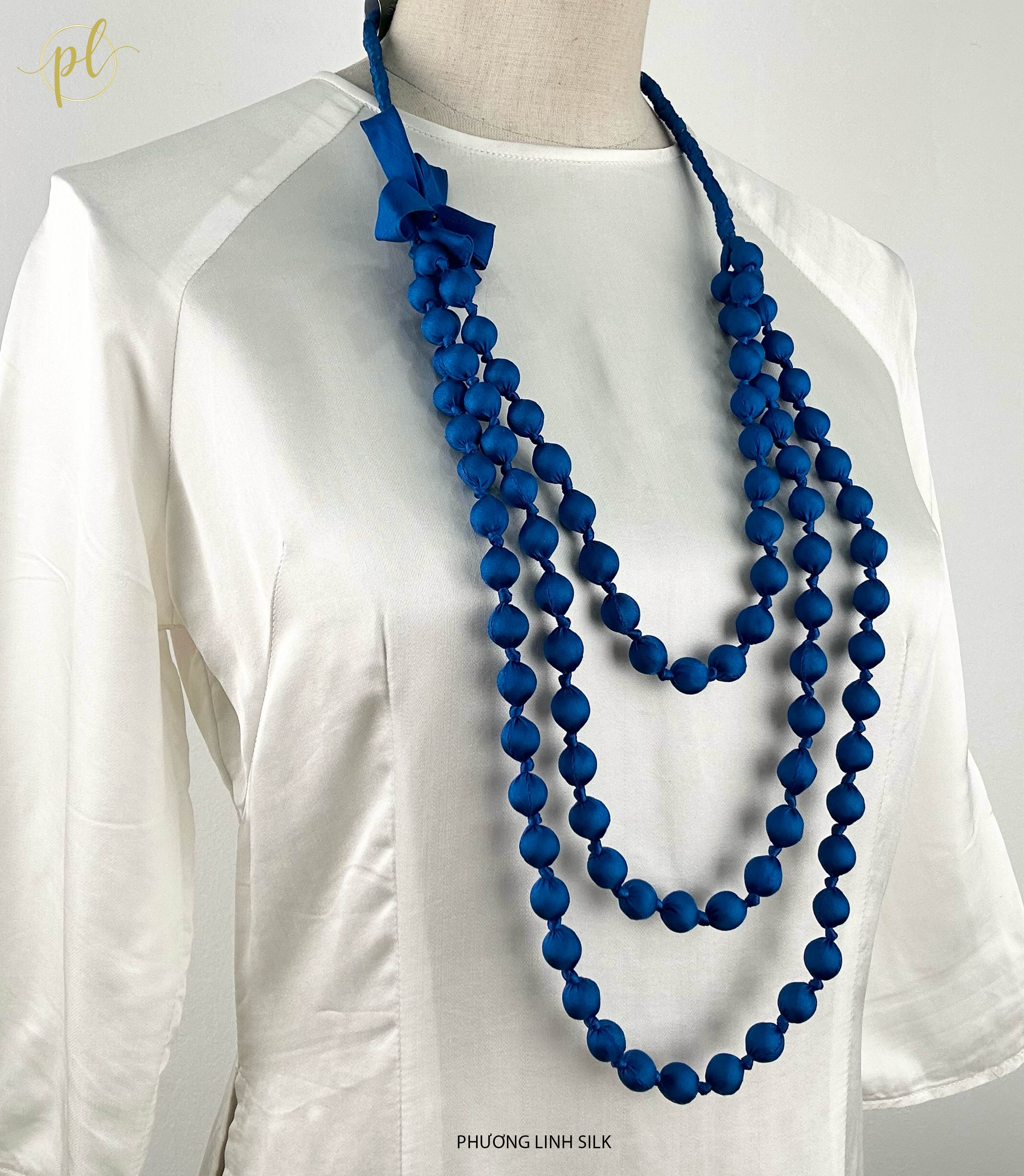 VÒNG HẠT GỖ TẾT NƠ BỌC LỤA TƠ TẰM