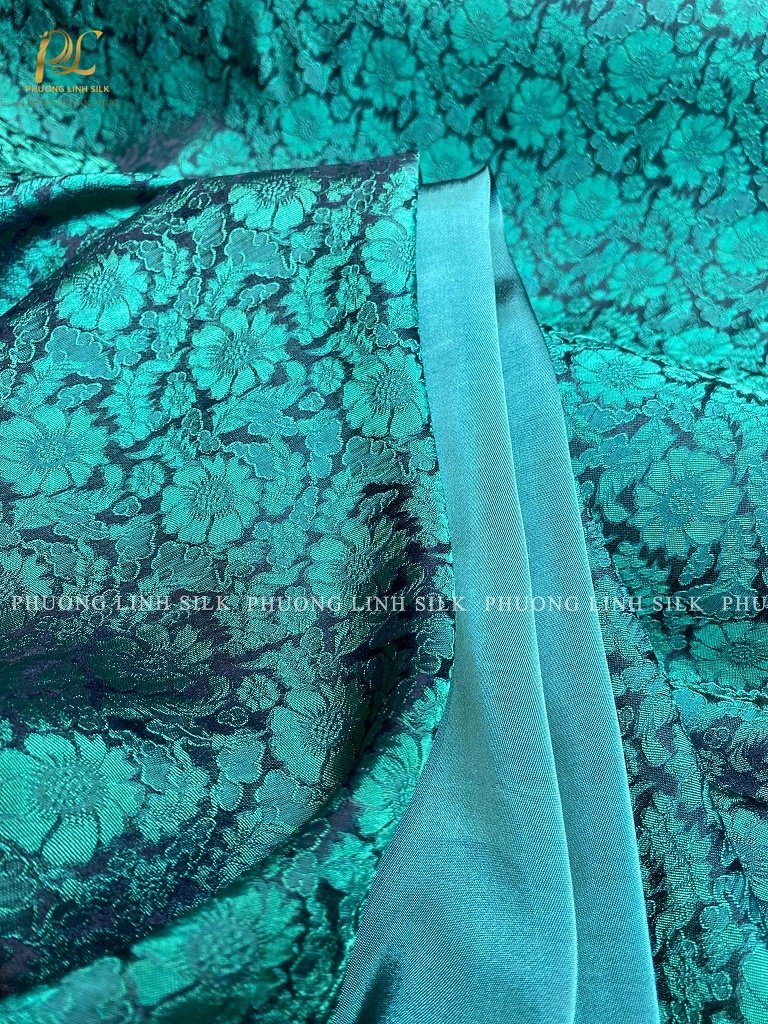 VẢI LỤA SATIN TƠ TẰM HOA CÚC MÀU XANH NGỌC VÀ VẢI SATIN TRƠN 70% TƠ TẰM