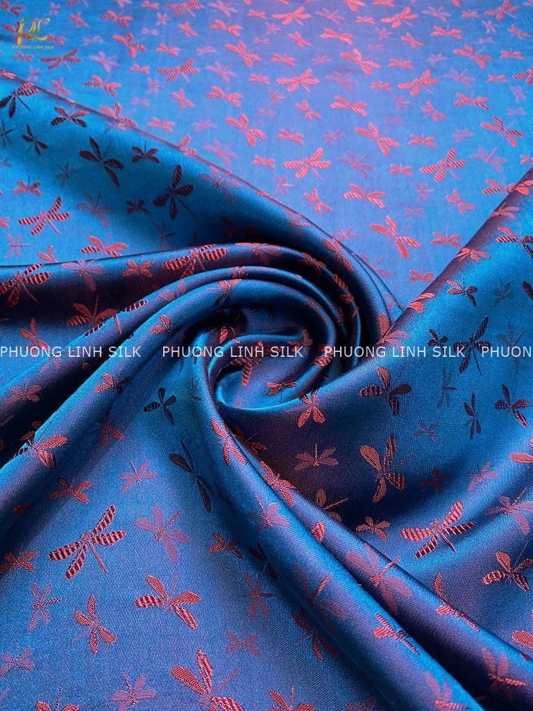 VẢI LỤA TƠ TẰM SATIN CHUỒN CHUỒN MÀU XANH ÁNH CAM