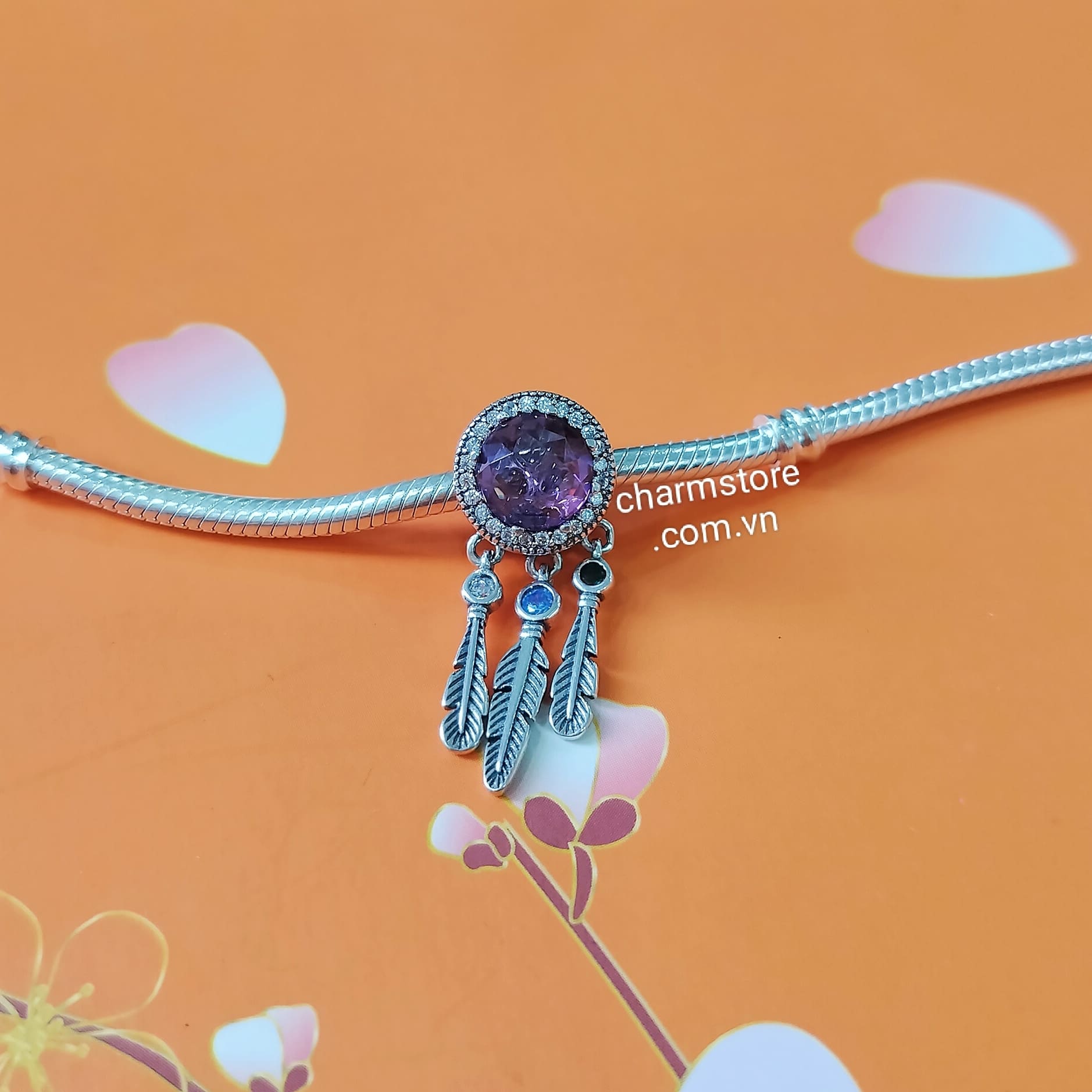 CHARM RADIANT TRÒN ĐÁ TÍM TREO CÁNH MÀU