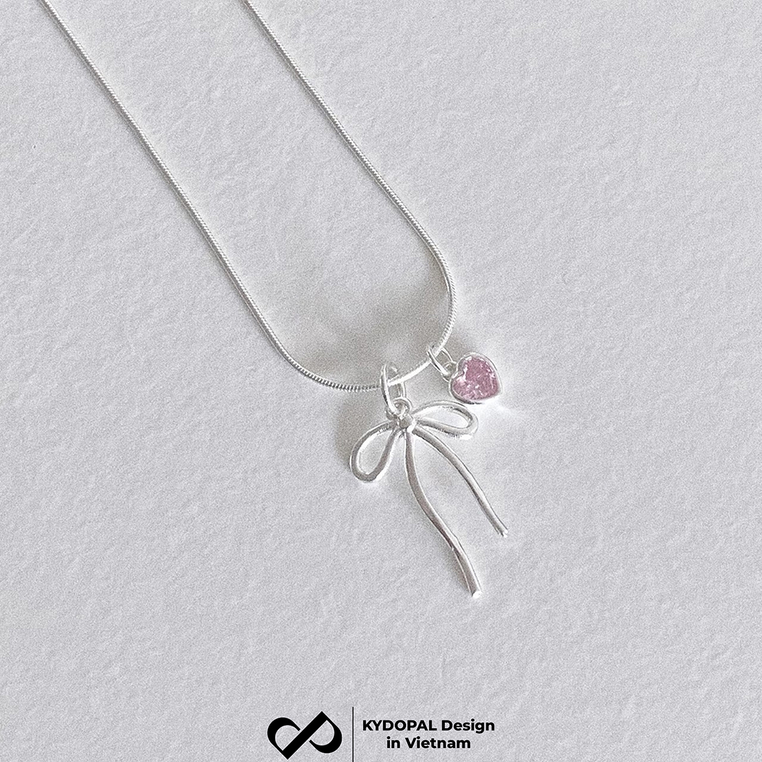 Dây chuyền bạc nữ KYDOPAL vòng cổ cá tính dây mì mặt hình nơ trơn mix đá tim hồng xinh xắn - PAL9C3C34