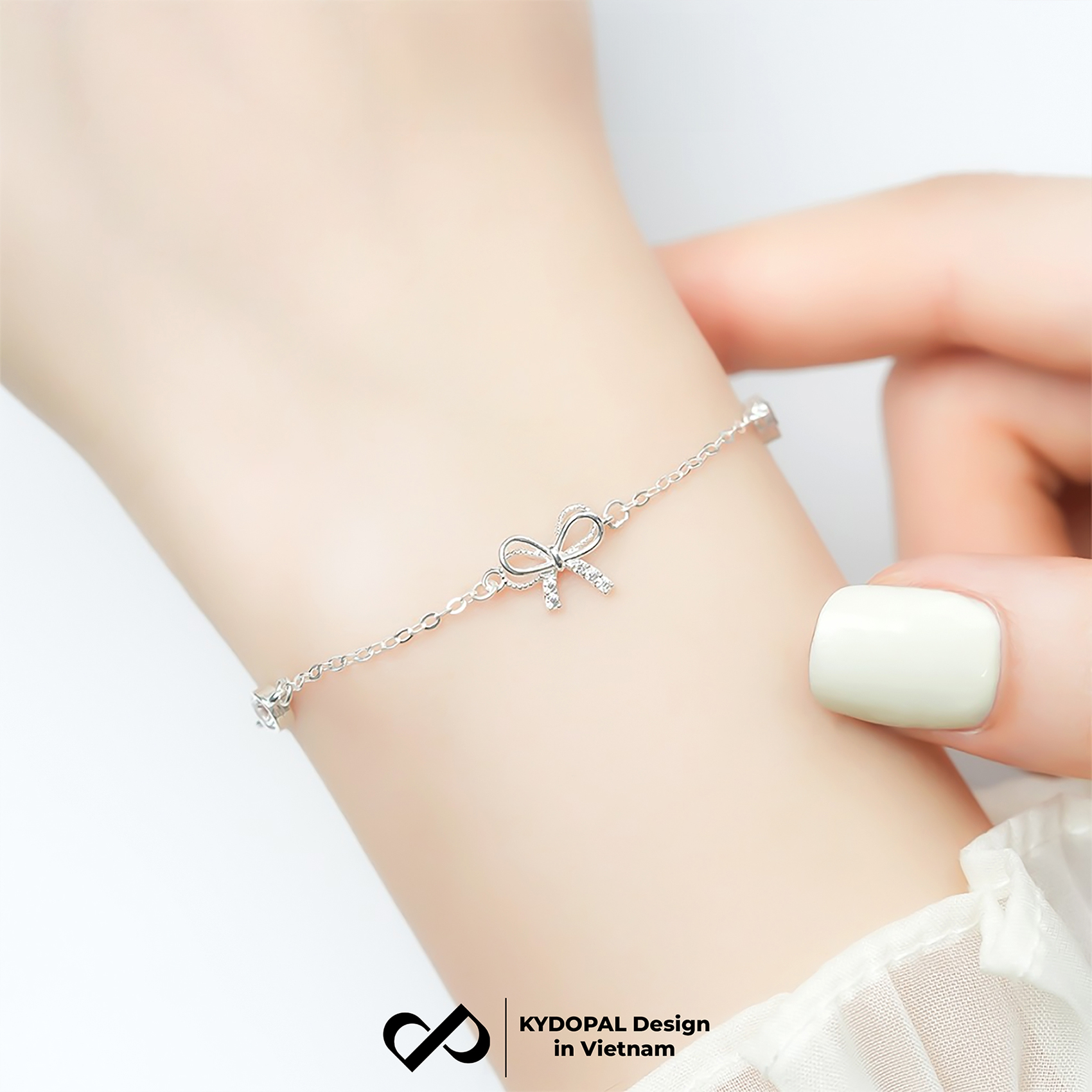 Lắc tay bạc nữ KYDOPAL nơ thắt cánh kép đính đá mix ổ đá tròn xinh xắn dịu dàng 925 - PAL9C8L16