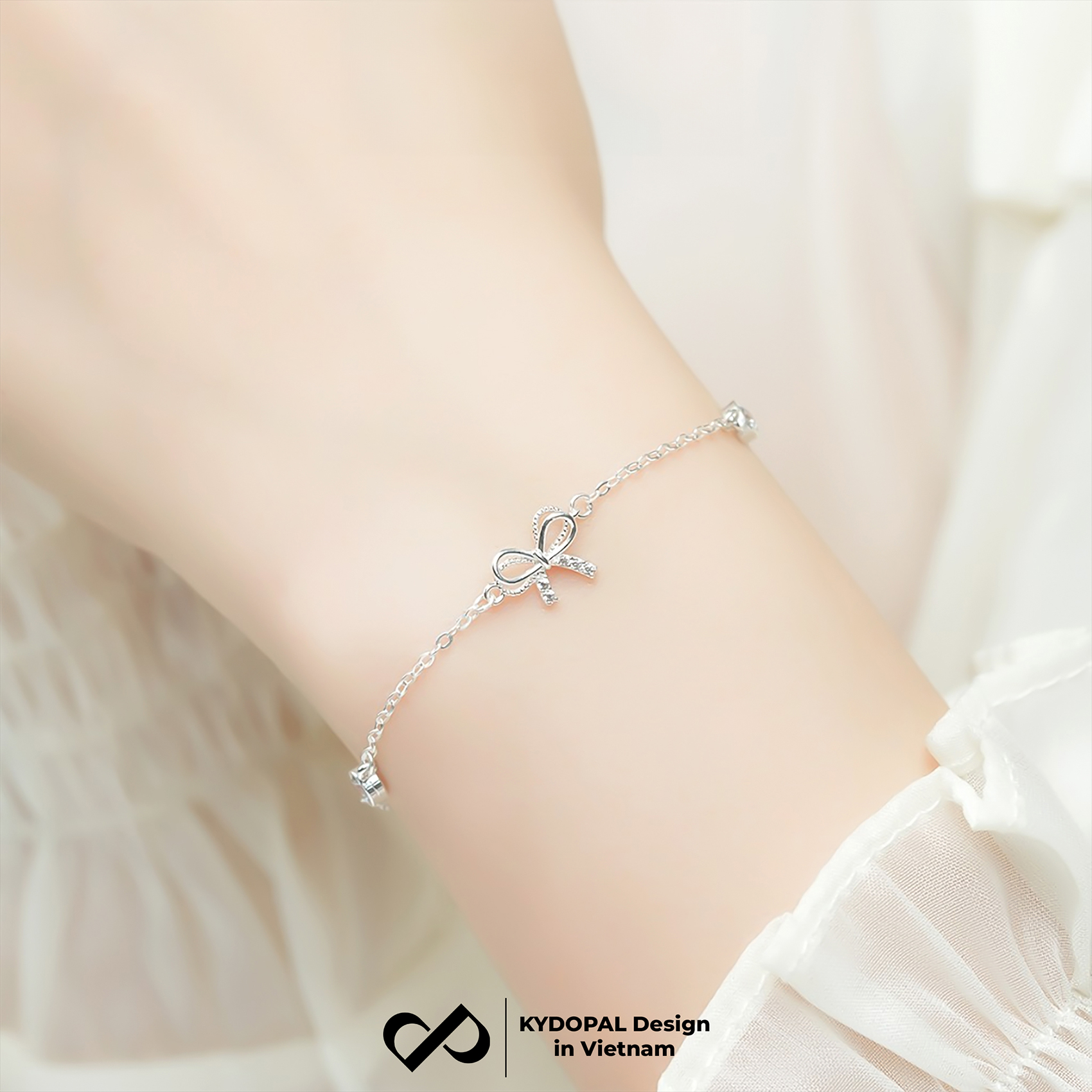 Lắc tay bạc nữ KYDOPAL nơ thắt cánh kép đính đá mix ổ đá tròn xinh xắn dịu dàng 925 - PAL9C8L16