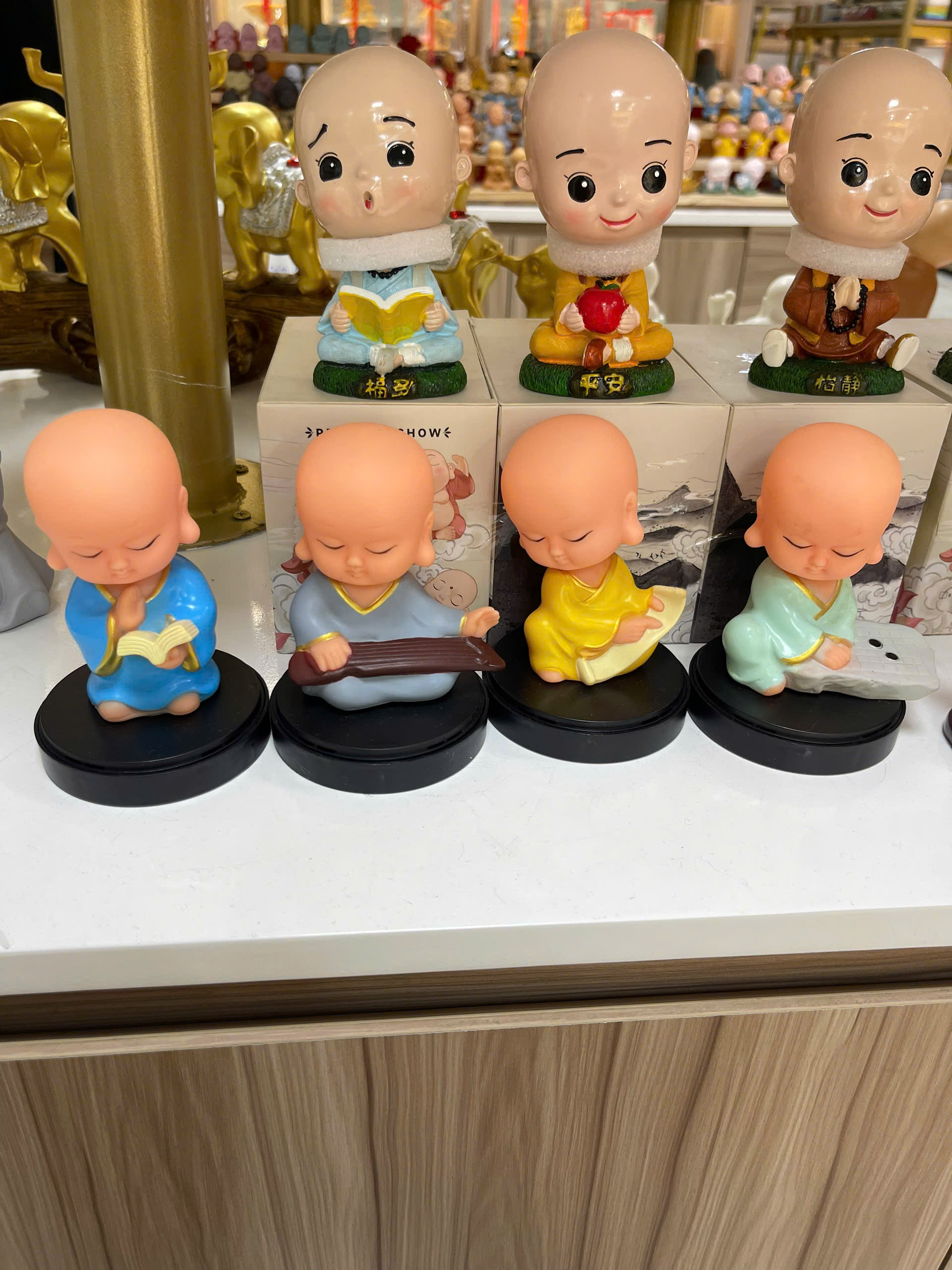 Bộ 4 chú tiểu cầm kỳ lò xo-NĐ