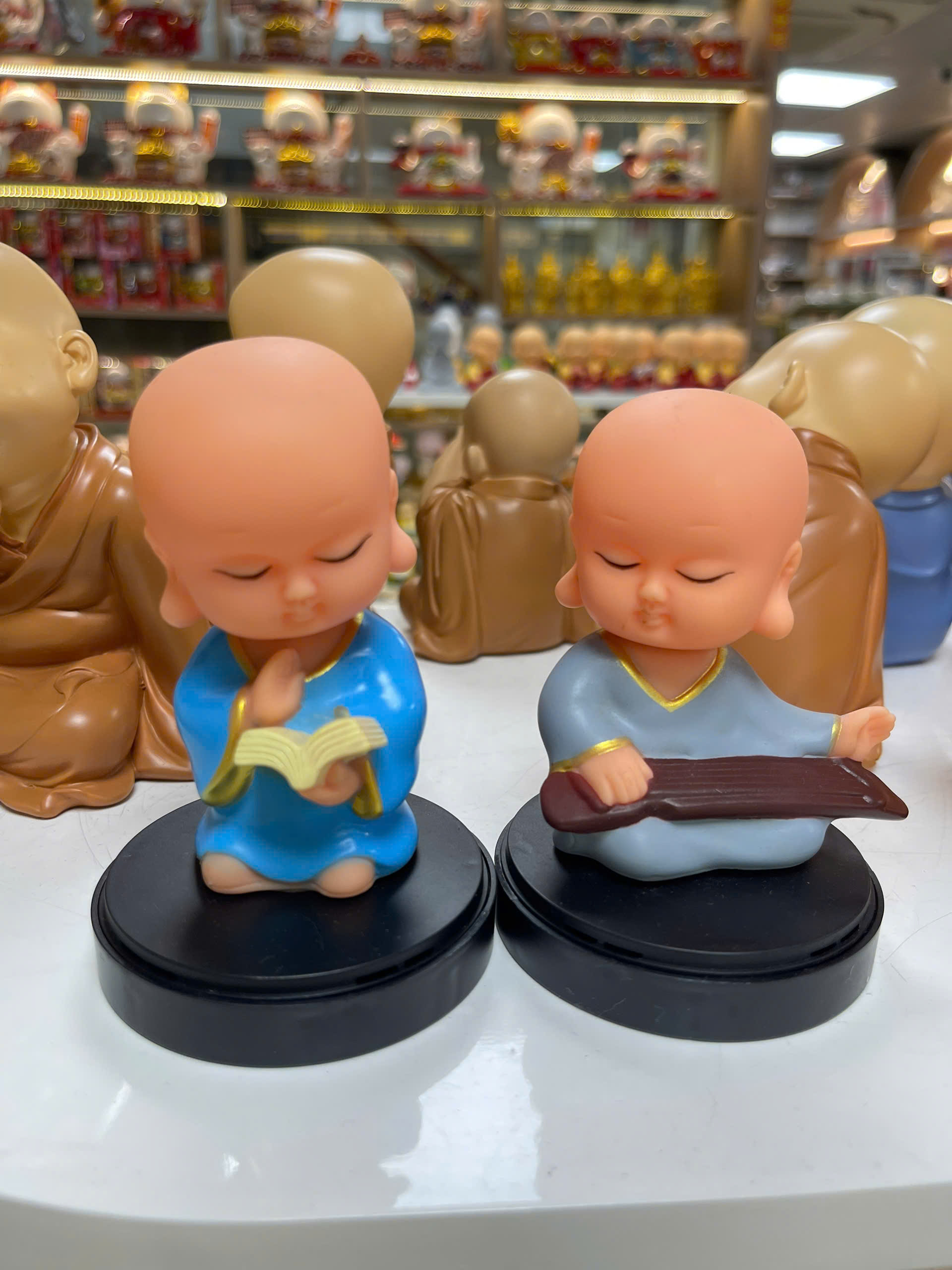 Bộ 4 chú tiểu cầm kỳ lò xo-NĐ