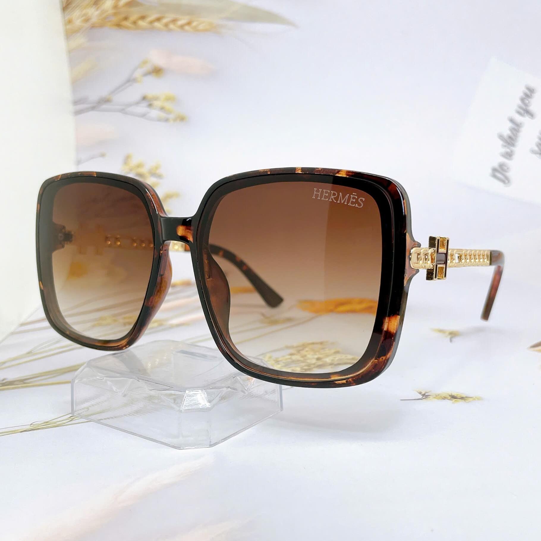 Mắt Kính Thời Trang Nữ - Kính Hermes Nữ Vuông Nâu Hổ Phách Gọng Chữ H Phối Mắc Xích