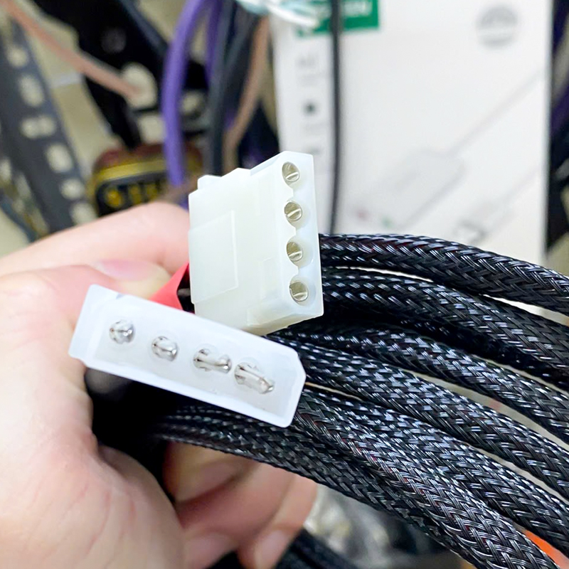 Old standard IDE 4-pin male-female power cord for computers with hard drives and DVD drives.