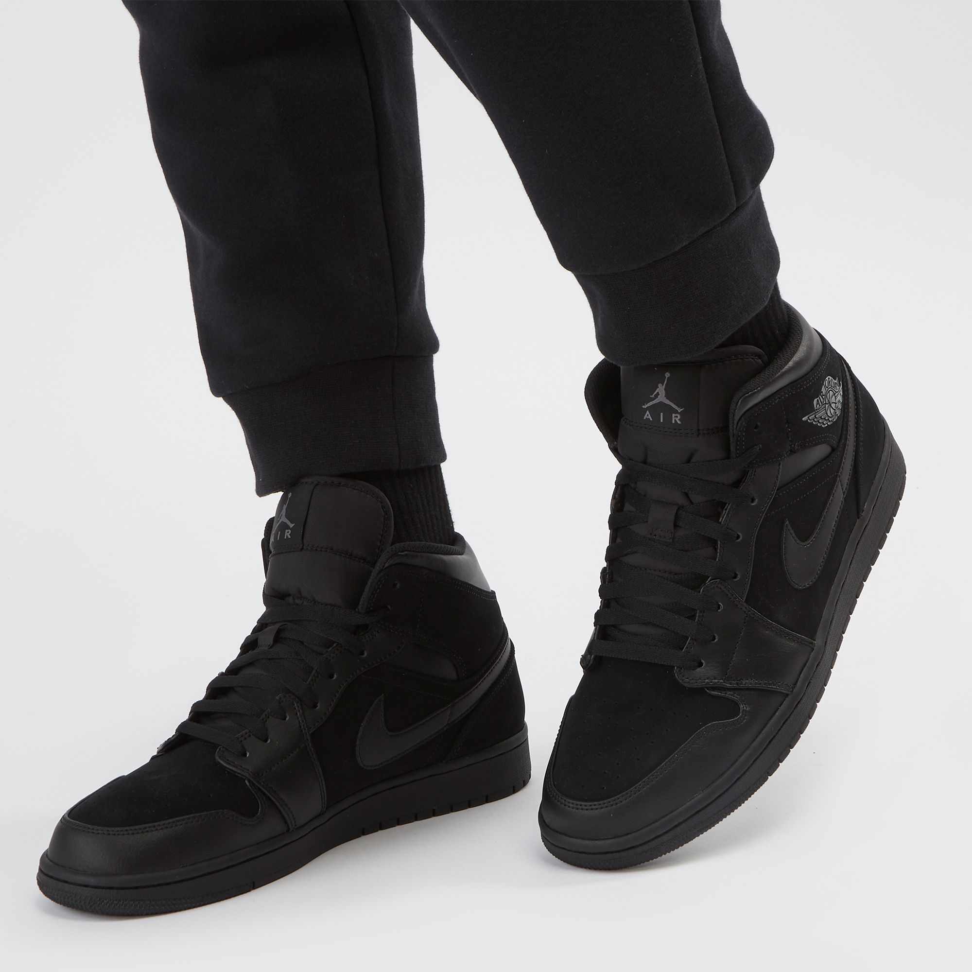 Già y Nike Air Jordan 1 Mid Triple Black 554725-050